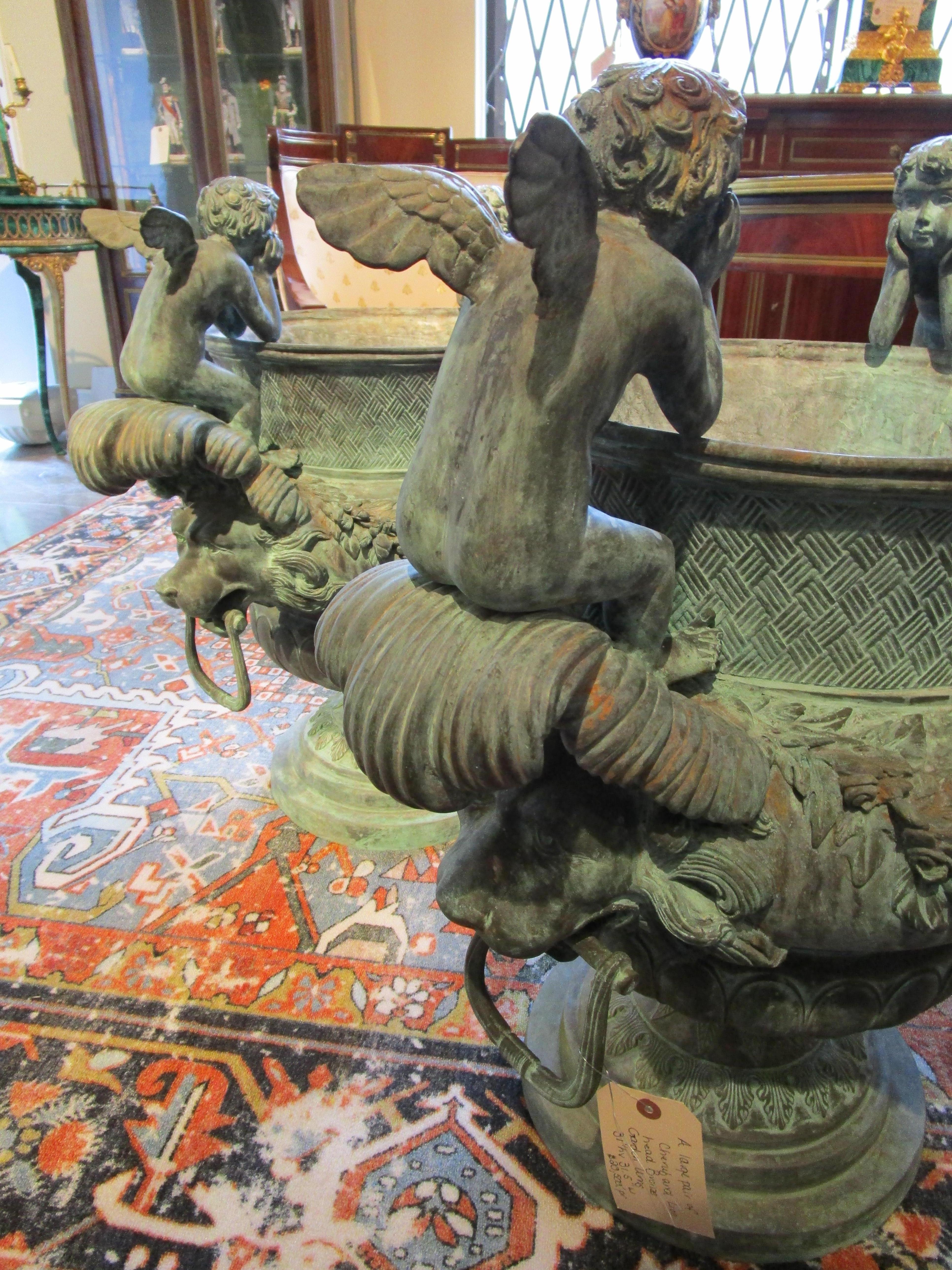 20th Century Large Pair of French Bronze Cherub and Lions Head Garden Urns