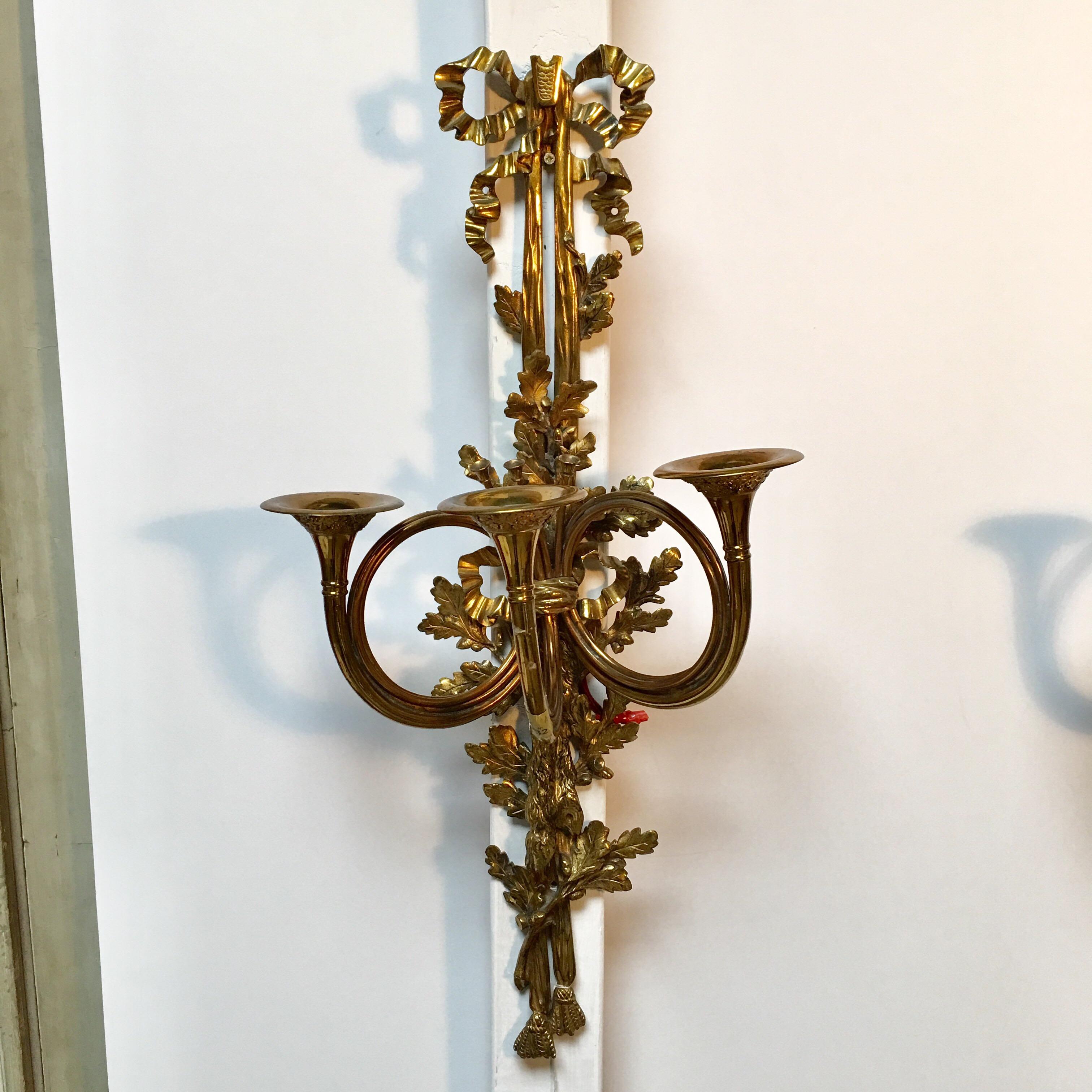 A large pair of French Louis XVI style wall sconces.