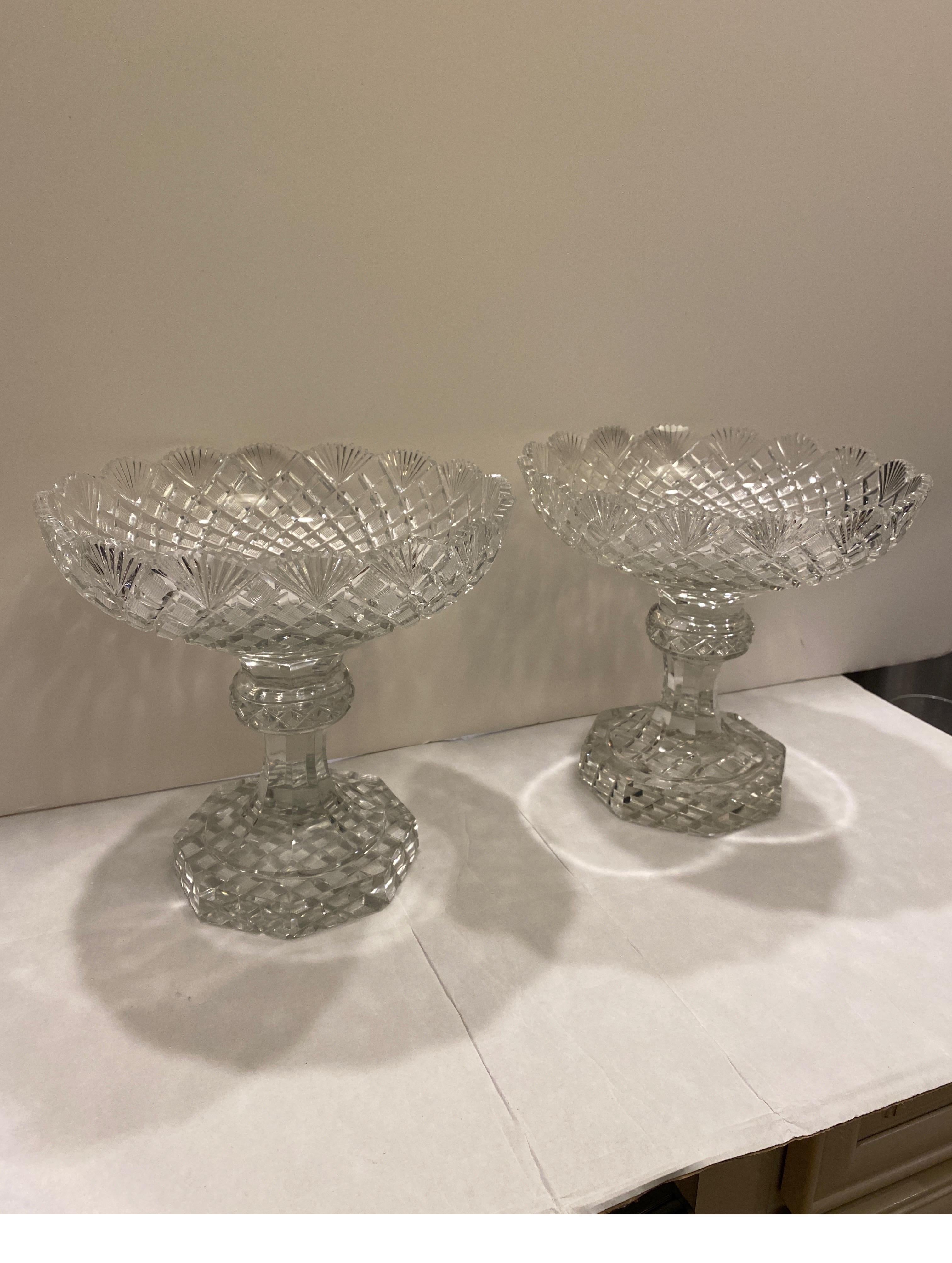 A stunning pair of Late 18th to early 19th Century hand cut glass footed compotes. The hand blown glass with all over cutting done by hand in England or Ireland, Circa 1800-20 9 inches in Diameter, 8.5 inches tall.