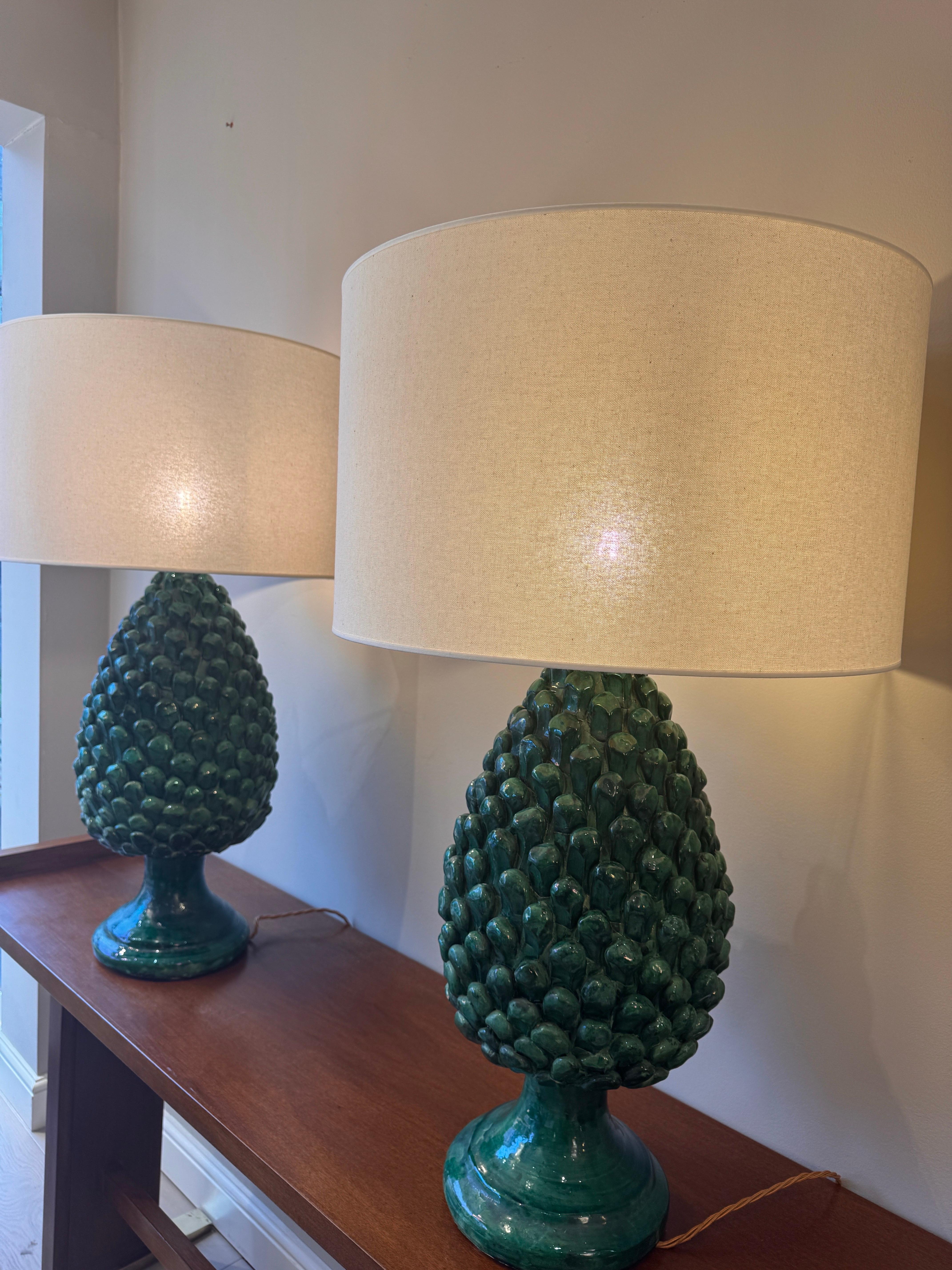 Brass A large pair of glazed ceramic pine cones table lamps For Sale
