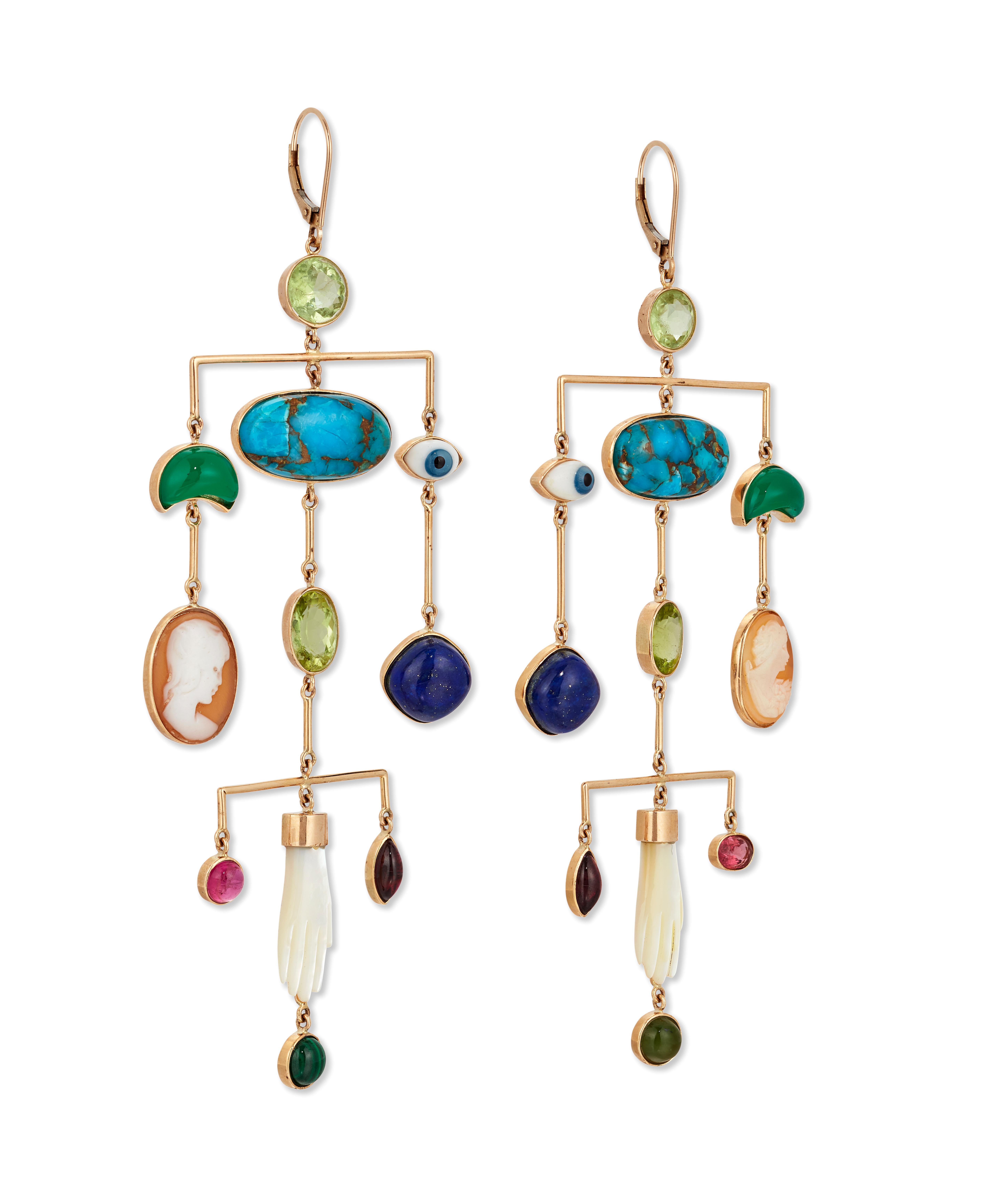 Each articulated Pendant suspending a series of antique charms and faceted gems, including turquoise, Peridot, Chrysoprase, Lapis, Garnet and carved shell hands.

Hook fittings set in 9ct Yellow gold.