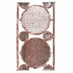 A large pair of iron panels with circle motif, C. 1940.