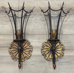 A large pair of Italian 1940s torchiere gilt and black metal wall sconces