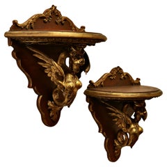 A Large Pair of Italian Carved Gilt Wall Brackets  These are beautifully carved