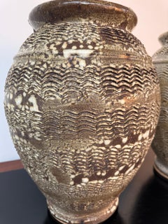 A large pair of Italian rustic stoneware jars