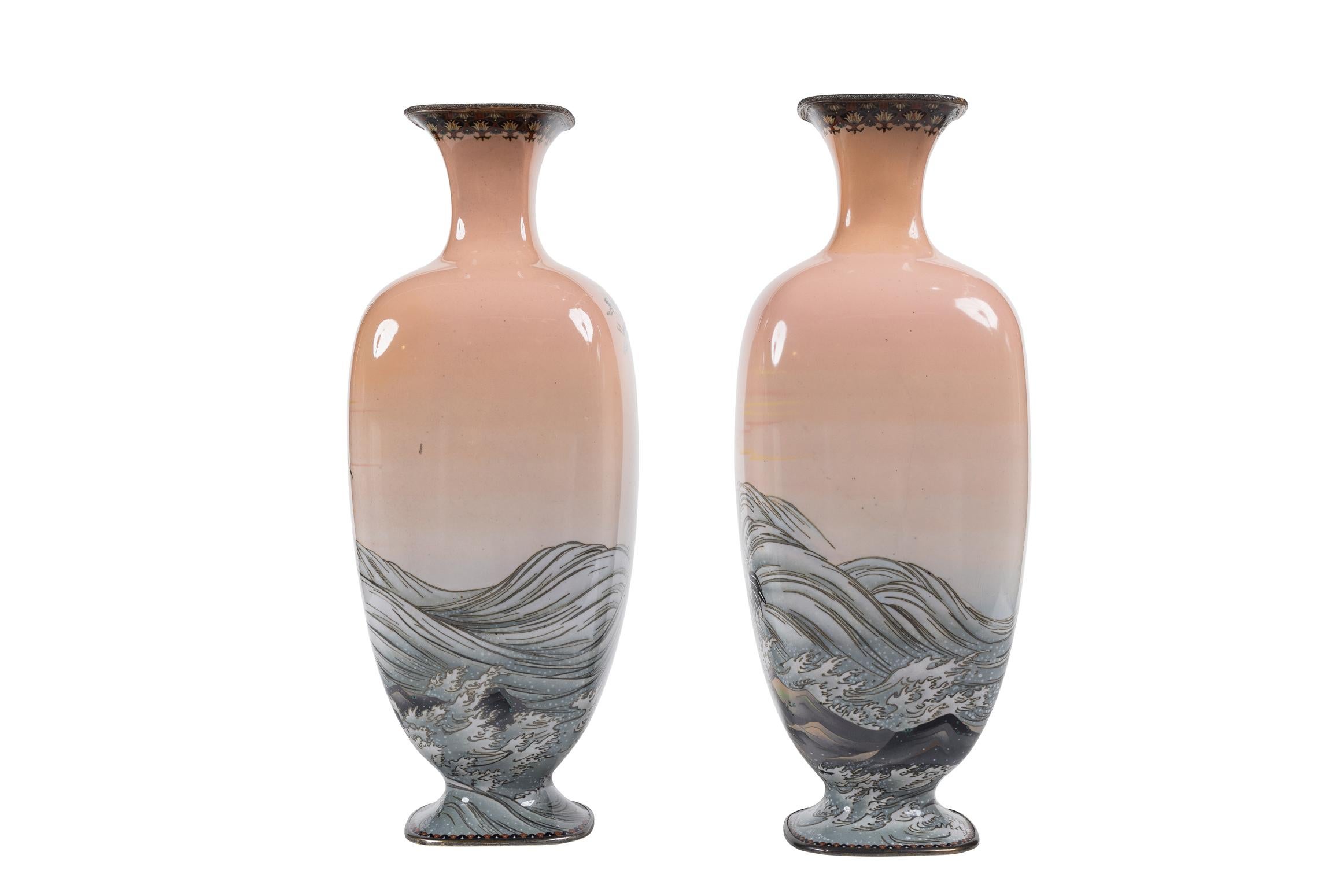 Presenting a truly captivating and highly collectible pair of Meiji Period Japanese Cloisonné Enamel Pink-Ground Vases, attributed to the renowned artist Hayashi Kodenji. These exceptional vases embody the artistry and sophistication of Japanese
