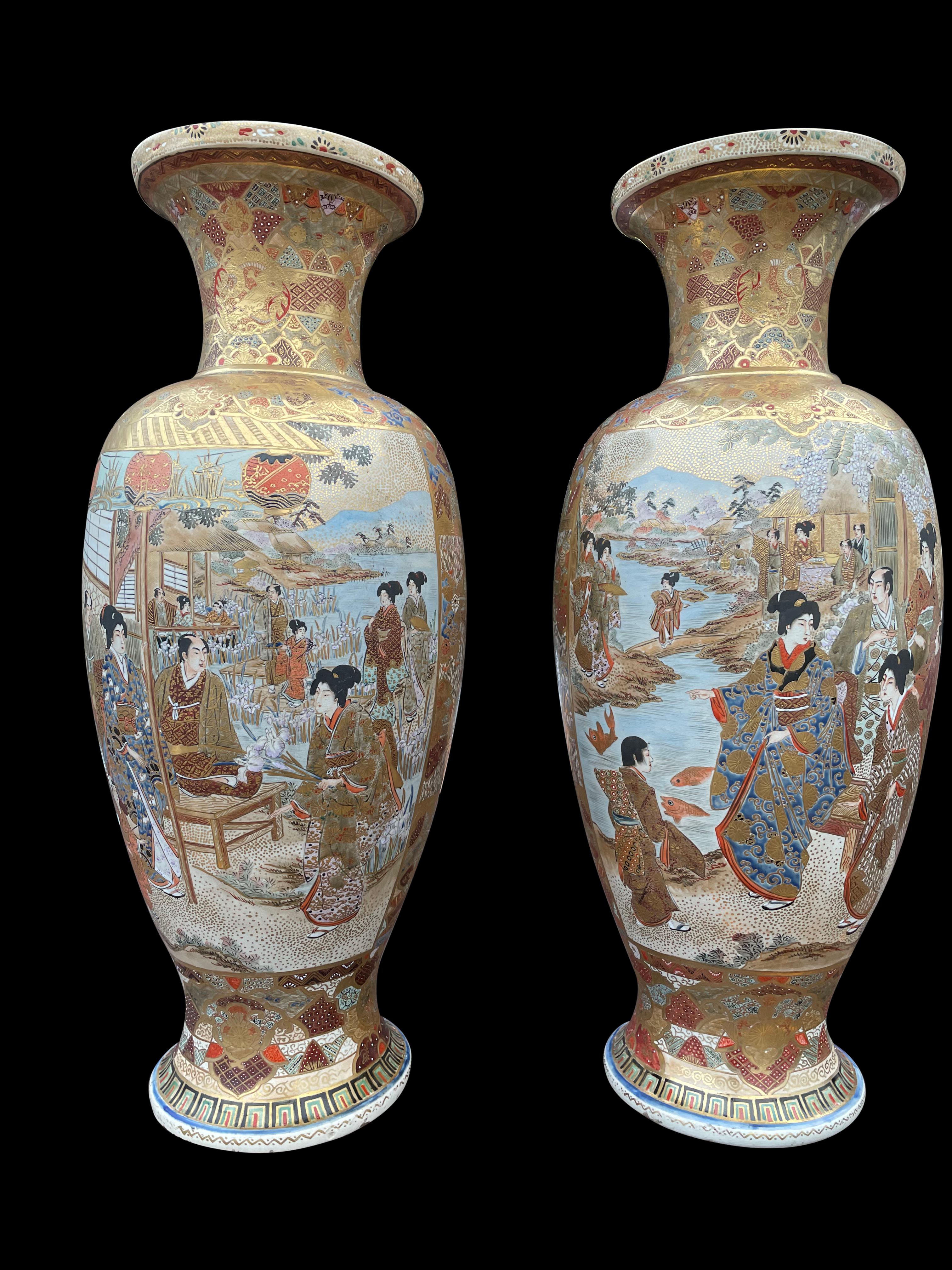 A beautiful a large pair of Japanese Satsuma vases, 19th century. Each decorated in gilt and enamels with two panels of samurai in a mountainous forest landscape, bordered by floral and brocade designs.
   