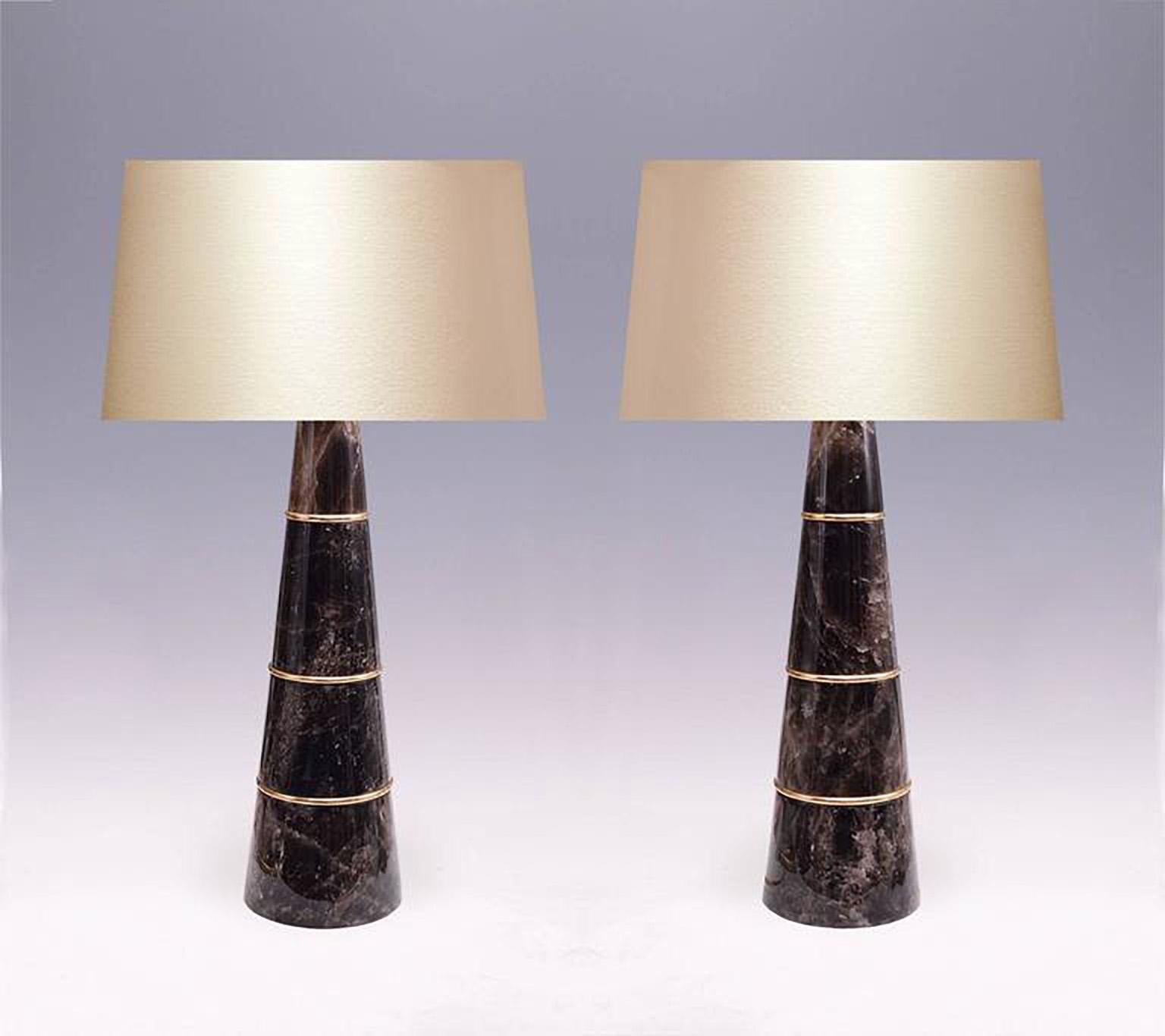 Fine carved cone shape dark rock crystal quartz lamps with polished brass inserts, created by Phoenix Gallery, NYC.
To the rock crystal: 22.75