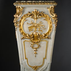 A Large Pair of Parcel-Gilt and Grey Painted Pedestals