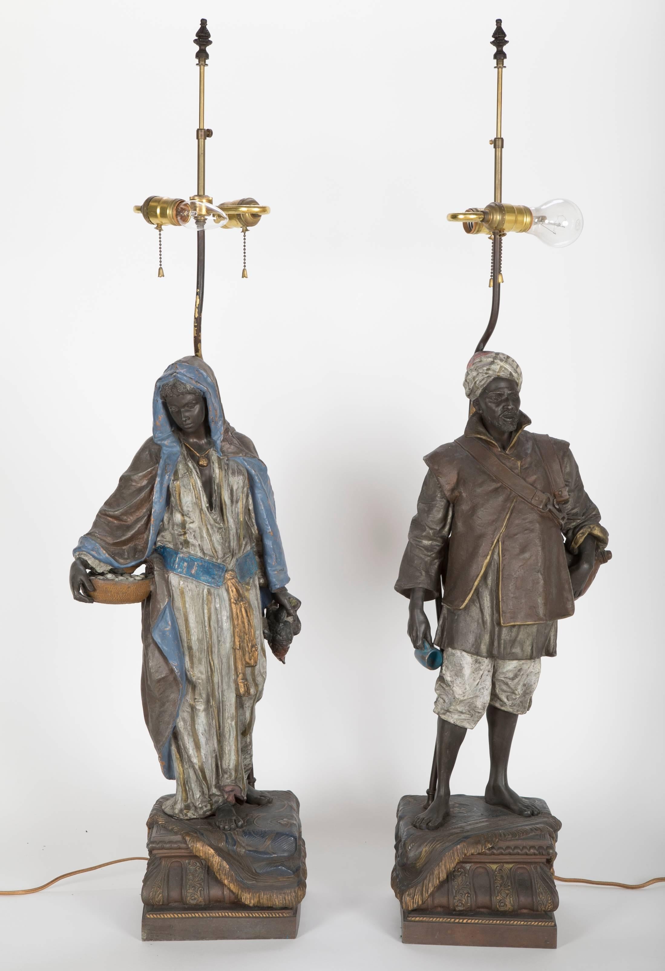 A pair of Viennese orientalist cold painted spelter lamps.