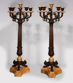 A large pair of Regency period six light candleabra