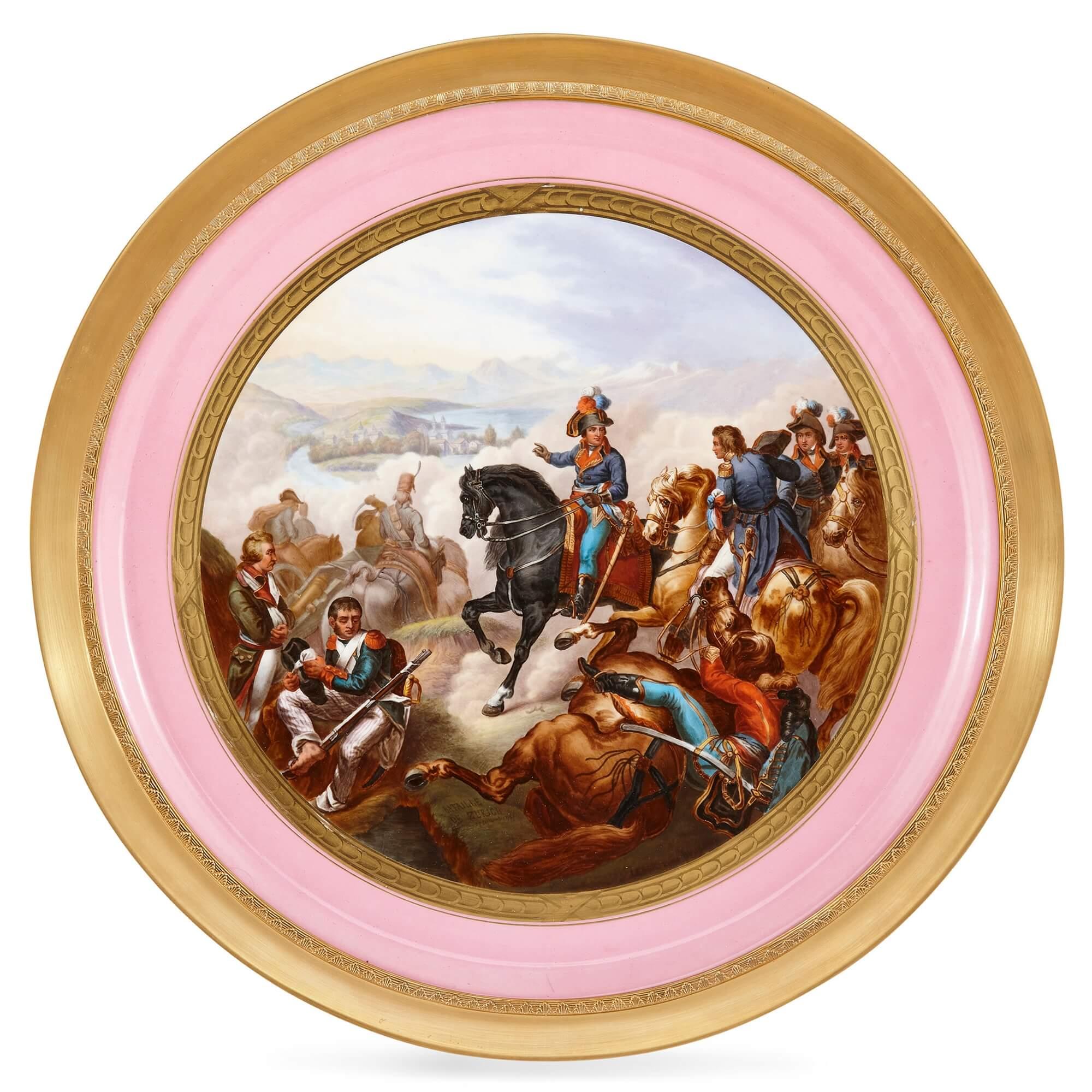 A large pair of Sevres style Napoleonic painted porcelain chargers
French, 19th century
Measures: 2cm high x 45cm in diameter, frames 51cm diameter

Excellently painted and finely crafted, these unusually grand Sevres style painted porcelain