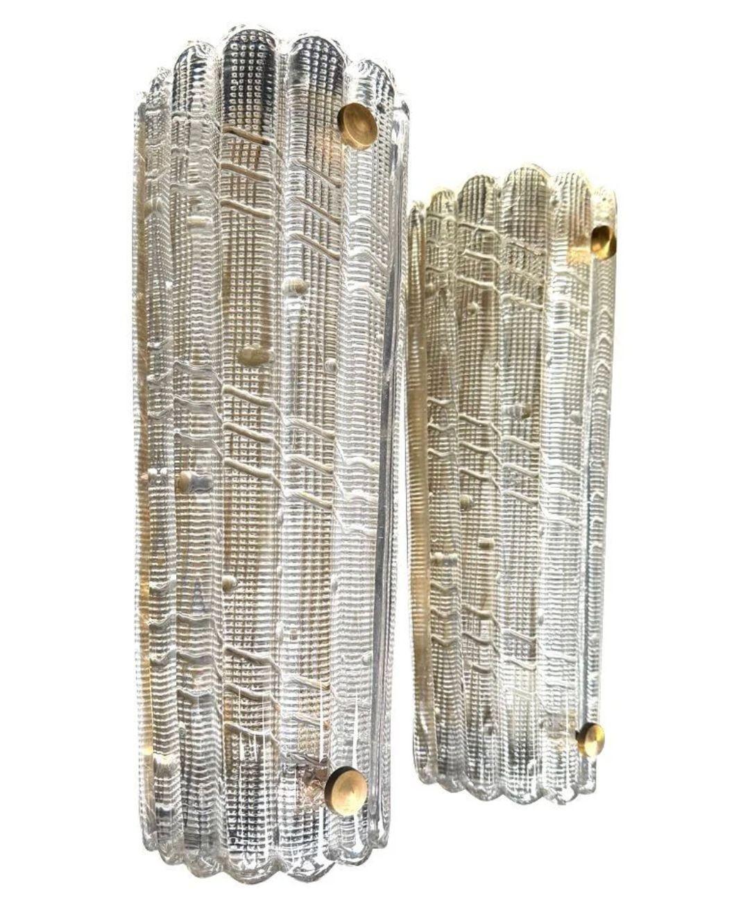 A large pair of Swedish 1960s Orrefors glass and brass wall sconces by Carl Fagerlund for Swedish lighting company Lyfa . Each light has very good quality,  thick, heavy Orrefors handmade glass shades with three lights inside, both have been rewired
