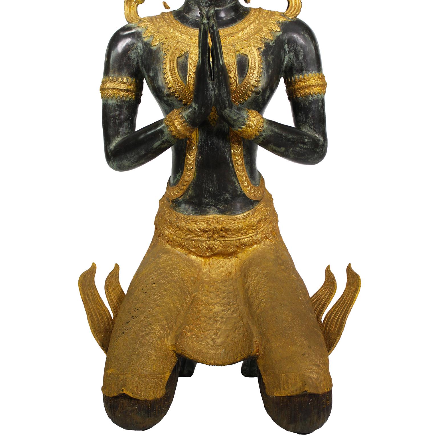 A Large Patinated and Parcel-Gilt-Bronze Thai Thepphanom Kneeling Angel Buddha For Sale 5