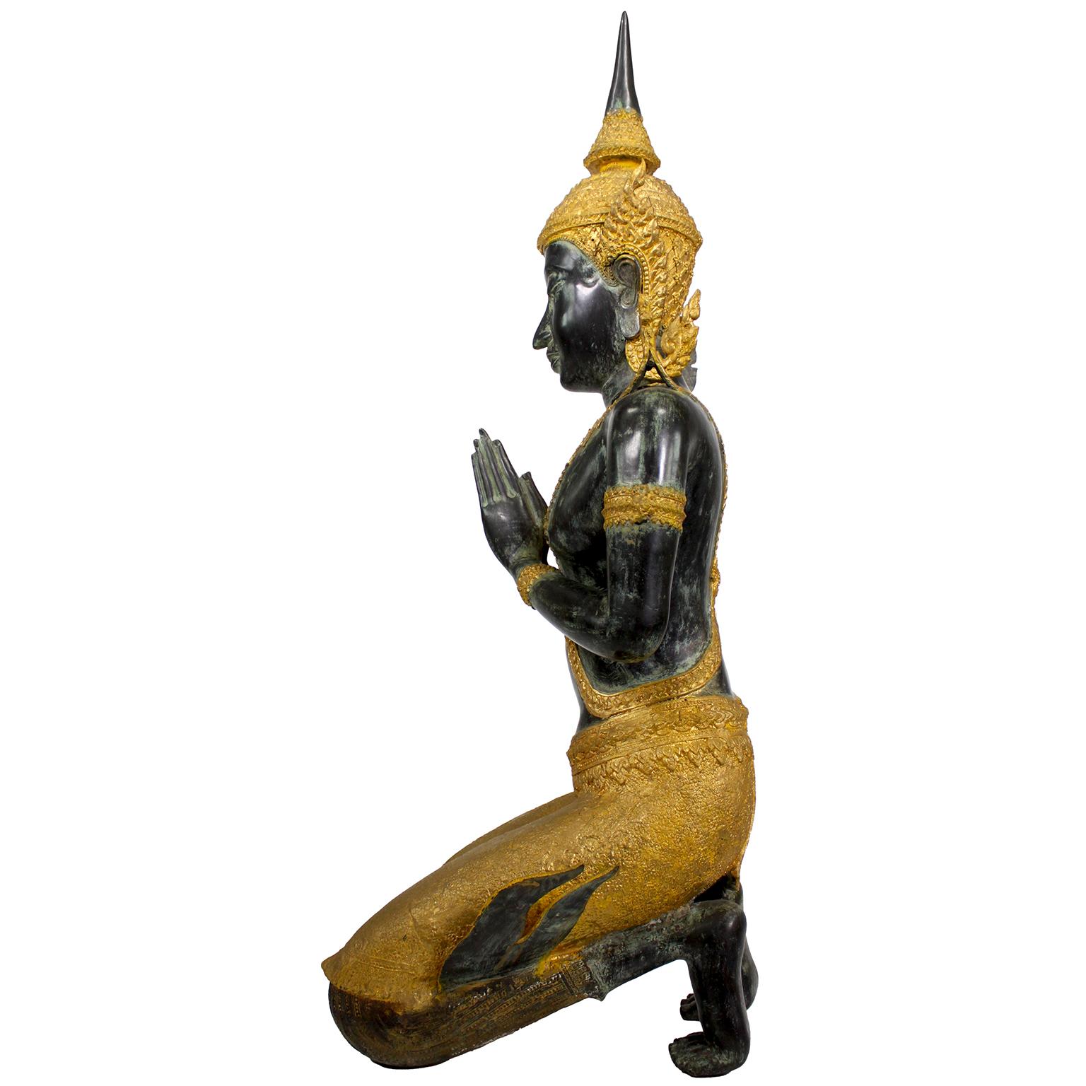 A Large Patinated and Parcel-Gilt-Bronze Thai Thepphanom Kneeling Angel Buddha In Good Condition For Sale In Los Angeles, CA