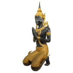 A Large Patinated and Parcel-Gilt-Bronze Thai Thepphanom Kneeling Angel Buddha