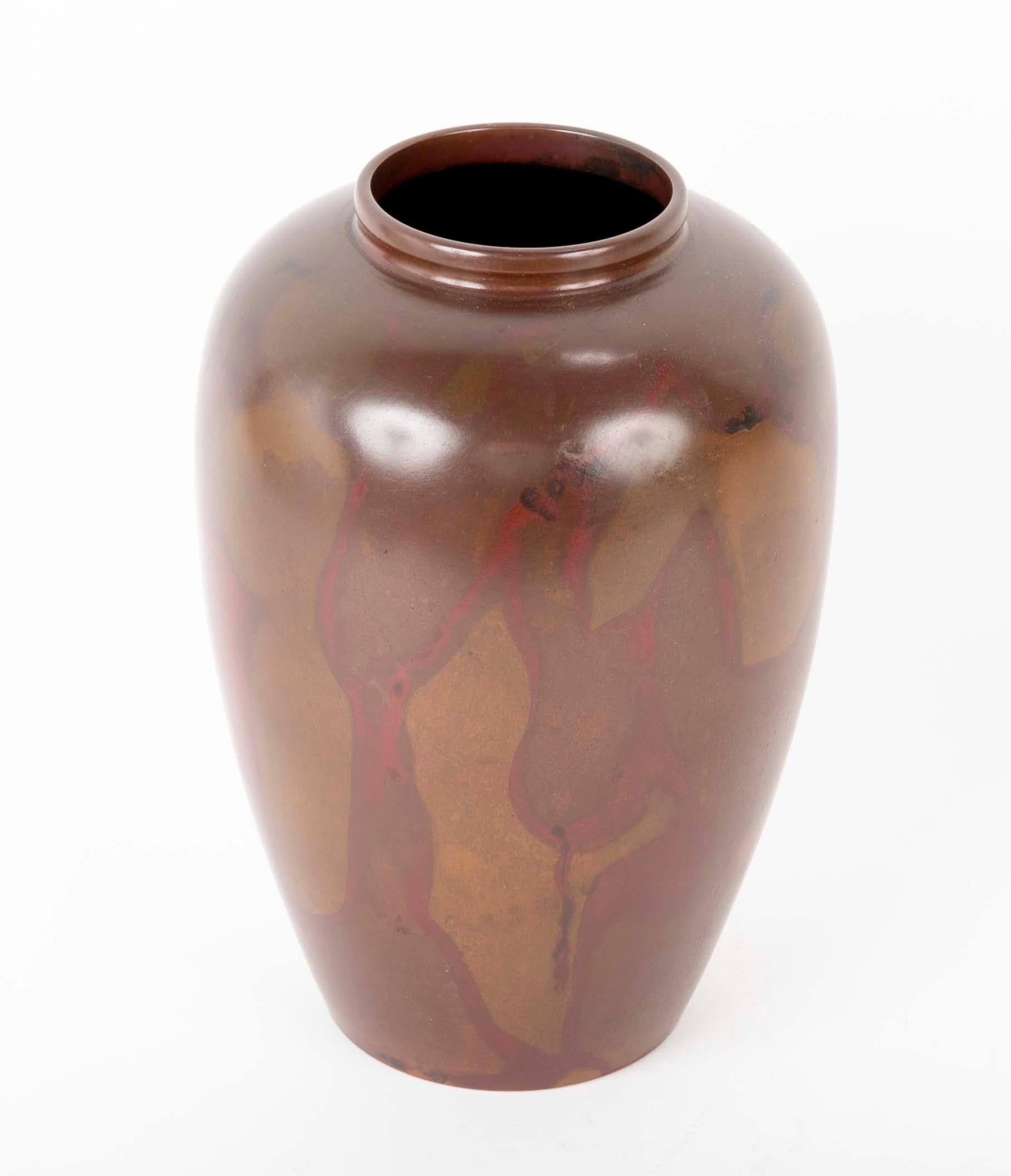 An extremely large Japanese bronze vase from the Showa period. Patinated using a Murashido oil technique to create the slightly marbleized looking red shapes.