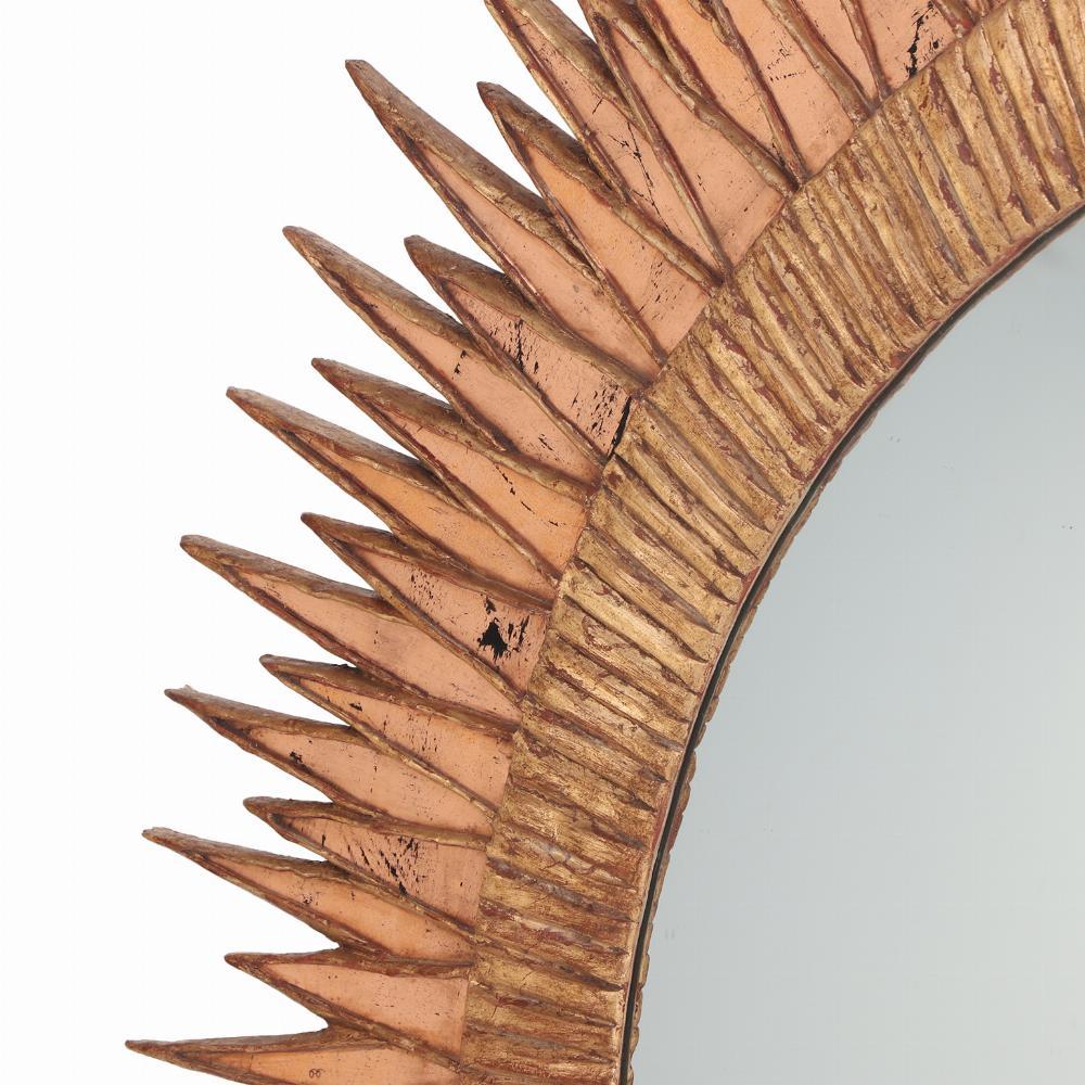 Mid-Century Modern A large pink glass and resin convex mirror, in a Soleil à Pointes