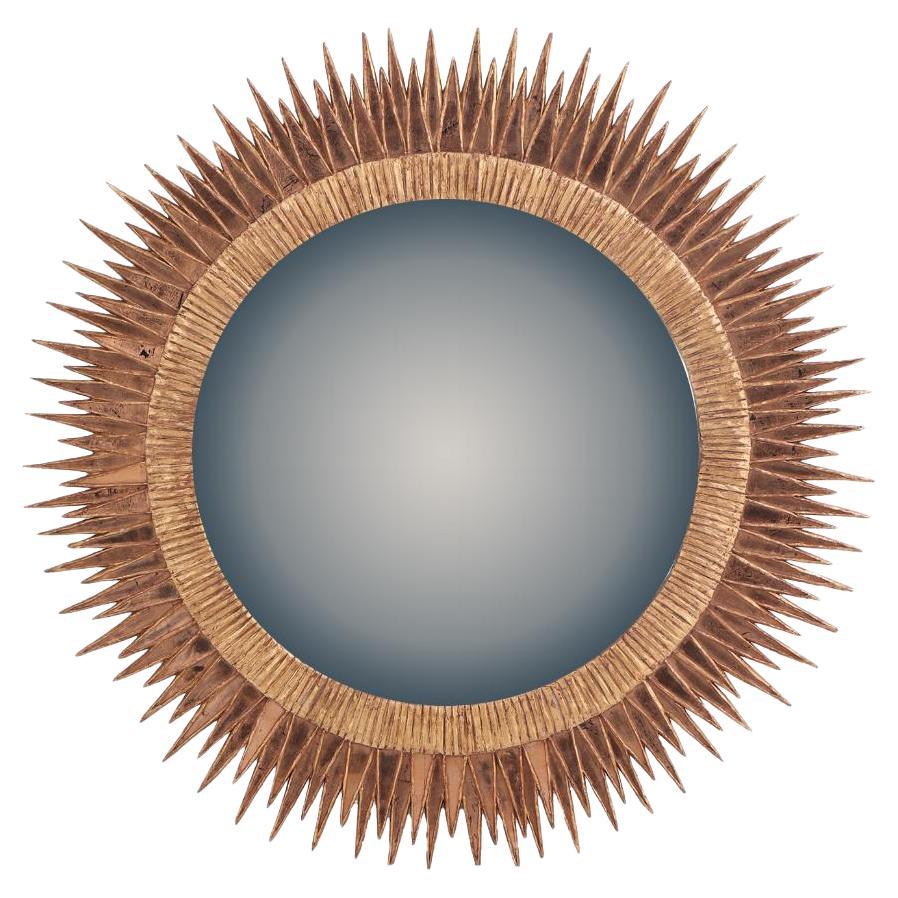 A large pink glass and resin convex mirror, in a Soleil à Pointes" design. For Sale