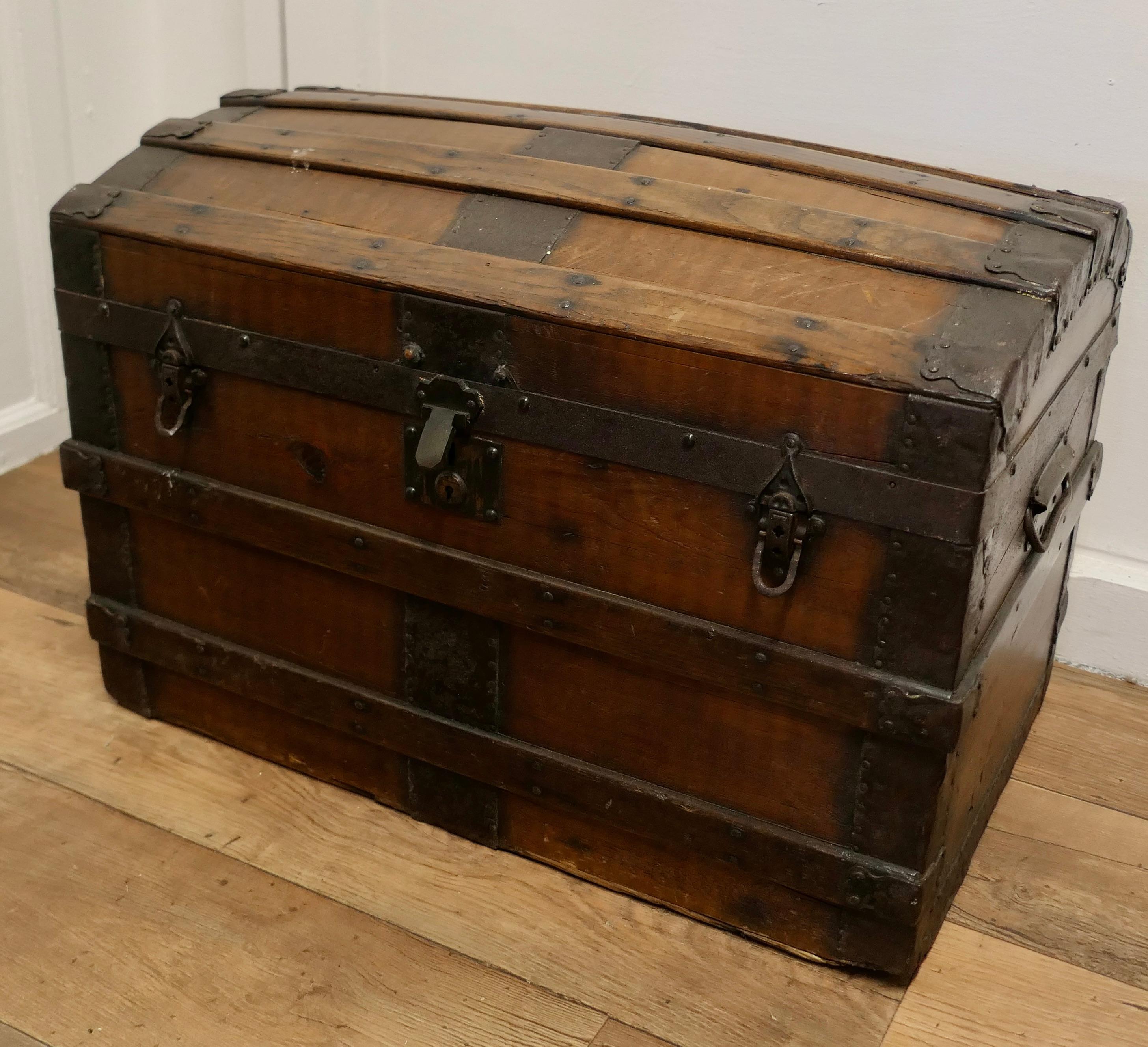 A Large Polished Oak and Pine Dome Top Chest  

This is a very attractive chest it has Oak and metal banding, iron carrying handles and is a desirable piece of free standing storage furniture
This is an old piece it has been Hand Waxed it is 28”