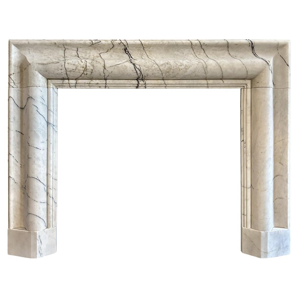 A large Reclaimed Calacatta Vagli Marble Bolection Fireplace Mantle  For Sale