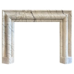 A large Reclaimed Calacatta Vagli Marble Bolection Fireplace Mantle 