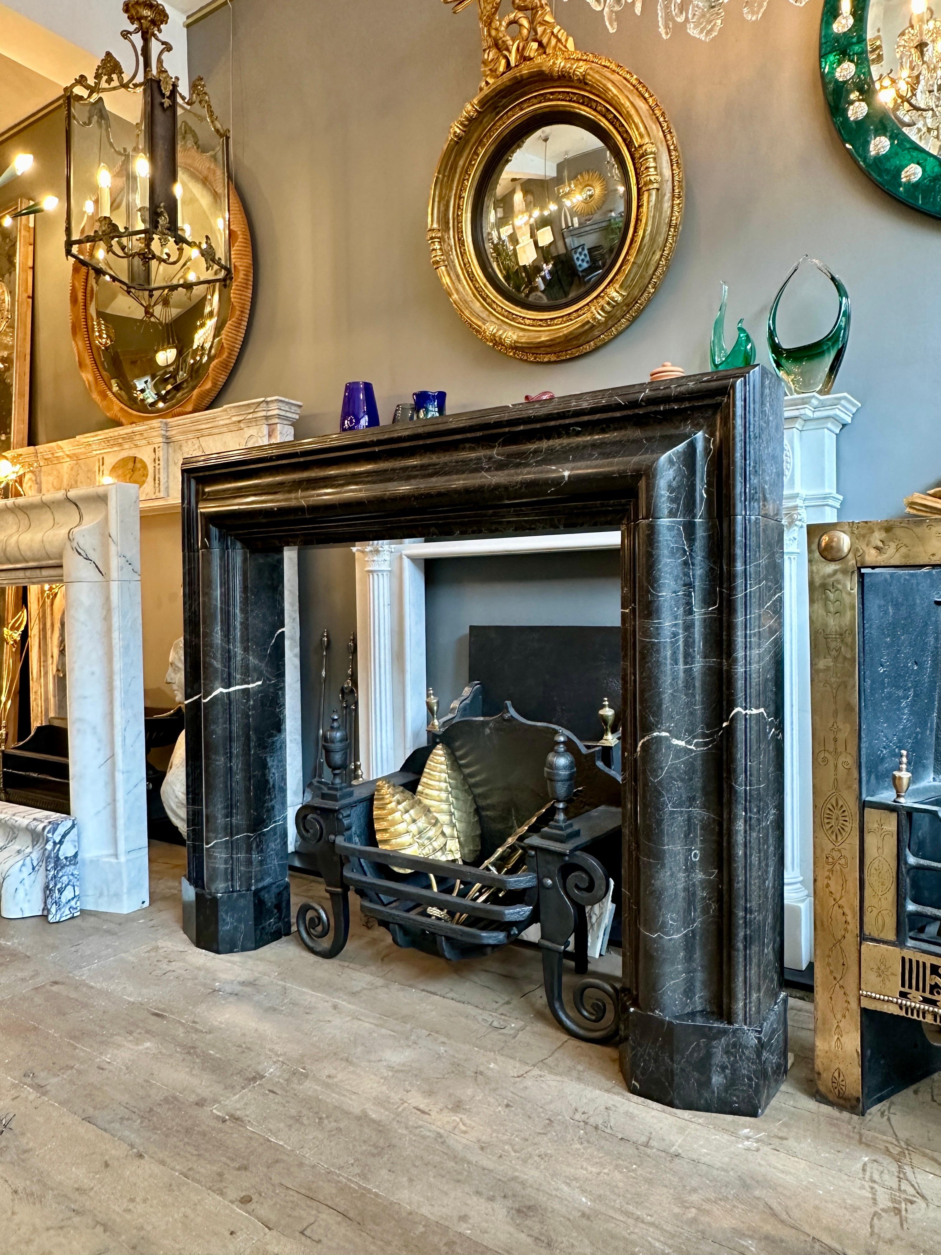 A Large Reclaimed Black Marble Bolection Fireplace Mantel In Good Condition For Sale In London, GB