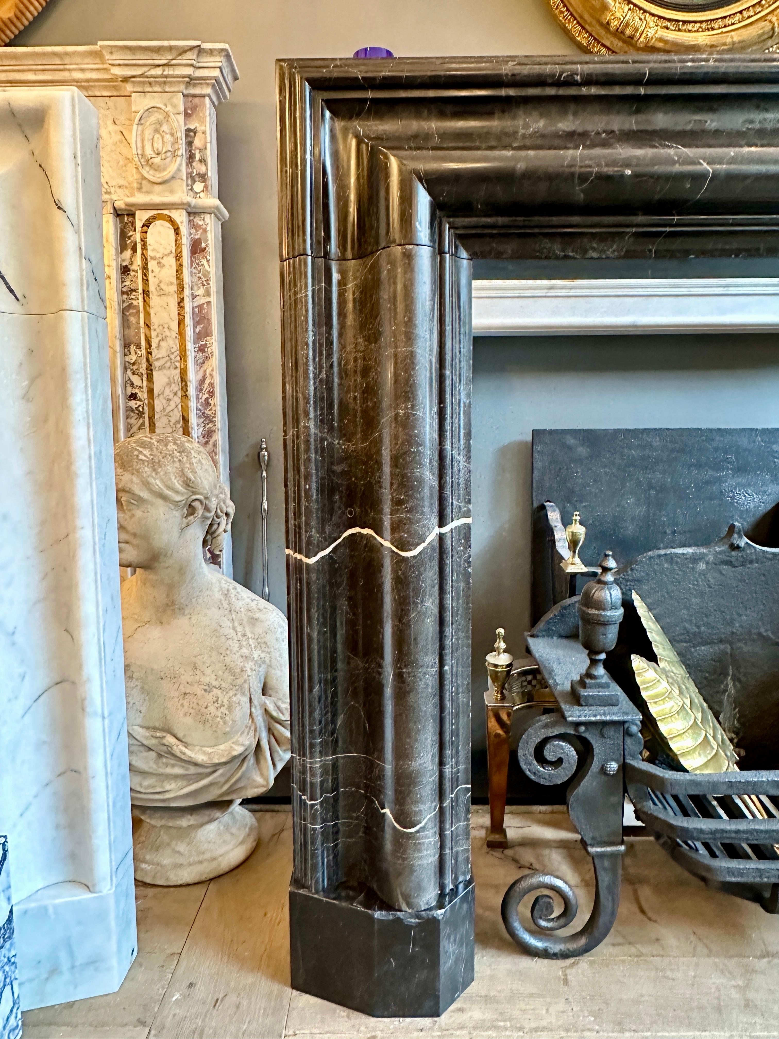 A Large Reclaimed Black Marble Bolection Fireplace Mantel For Sale 1