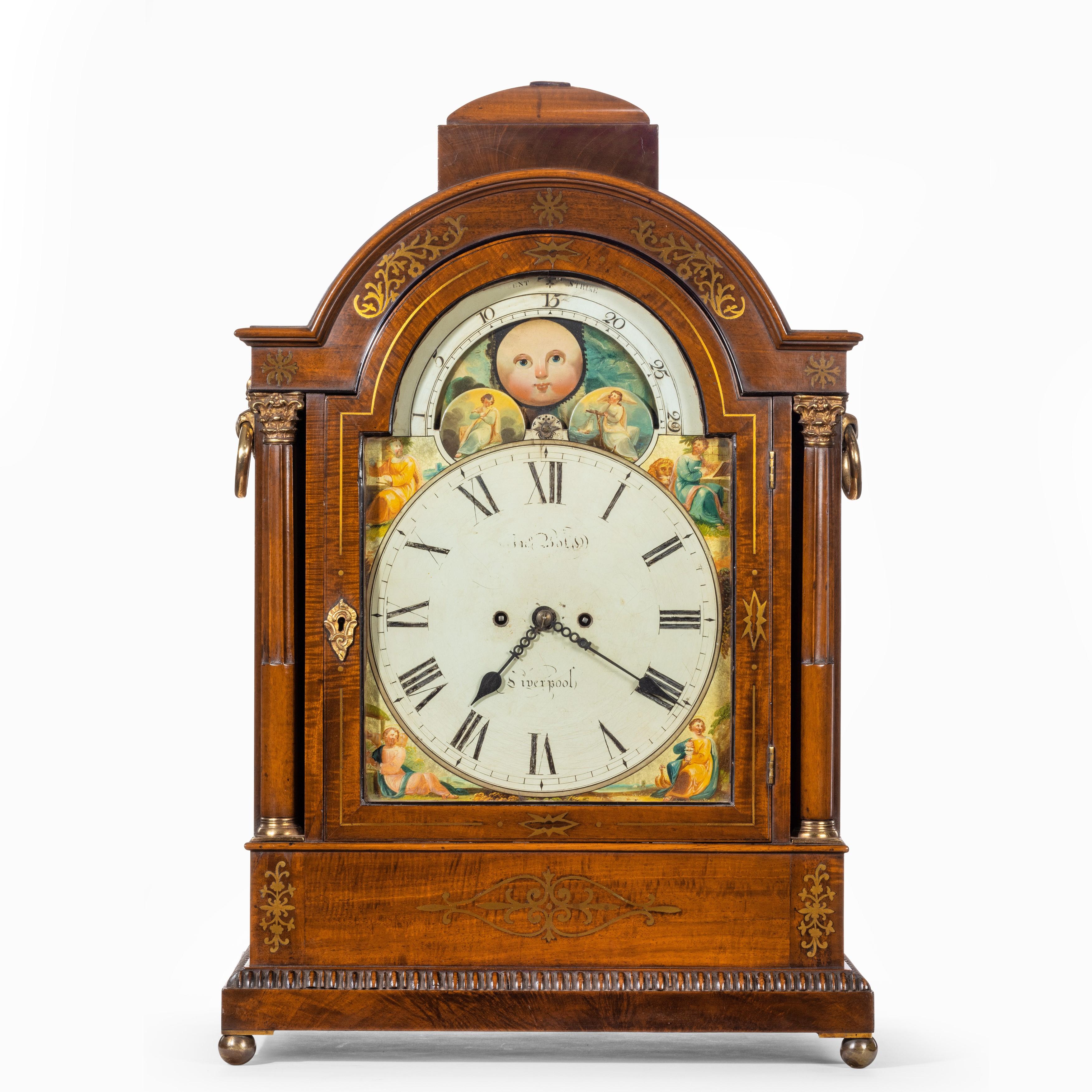 A large late Regency mahogany brass inlaid bracket clock by John Foster, the painted arched dial signed John Foster, Liverpool, with strike/silent, moon phase, and date, the two train fusee movement striking on a bell, set in a domed case with