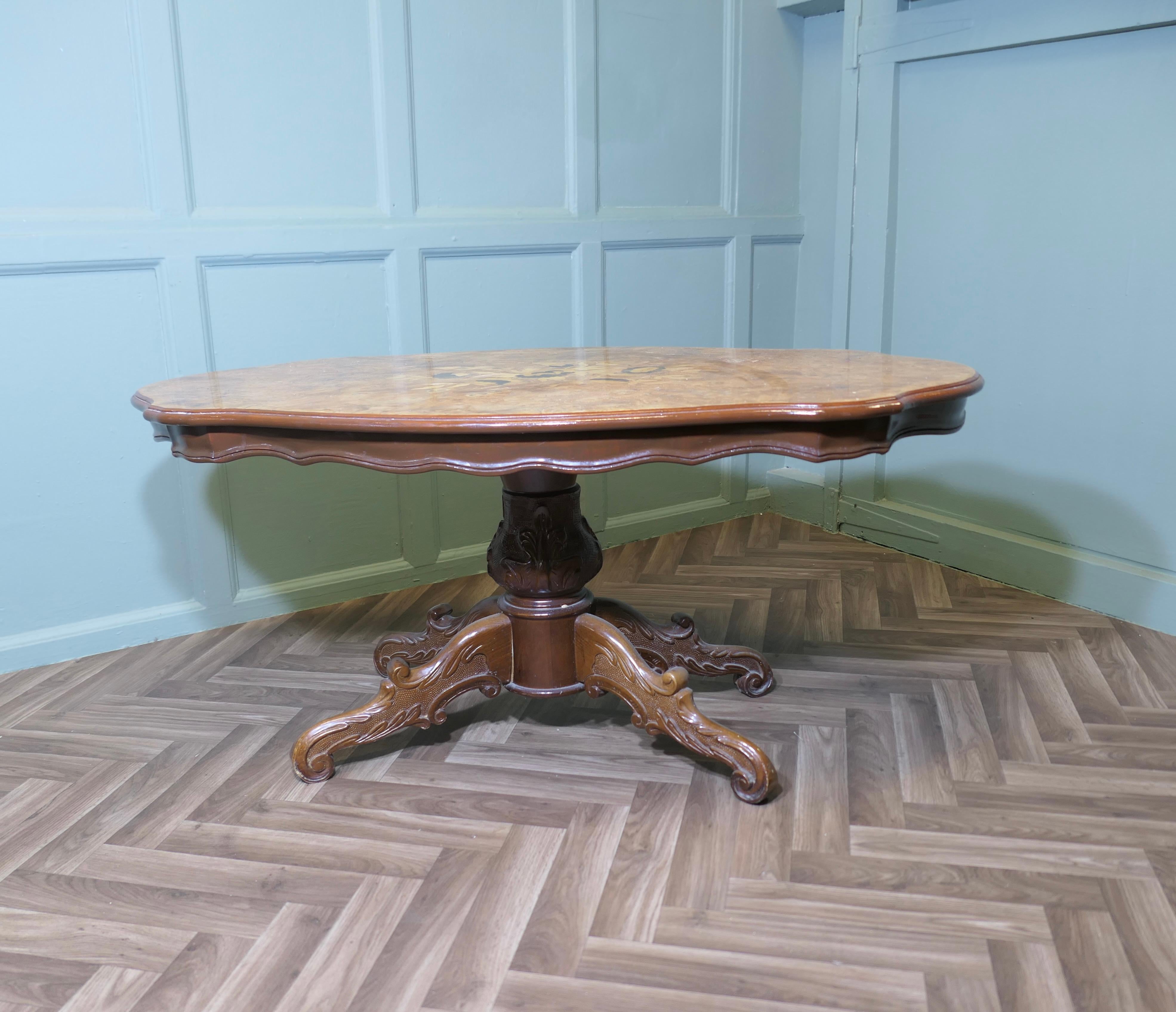 A Large Regency Style Birdseye Veneer Coffee Table

This is a very attractive piece, it is Oval and the top is decorated with Walnut and Maple veneers
The table is good quality, it stands on a carved 4 footed central leg
A very  good looking piece