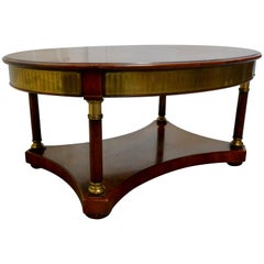 A Large Regency Walnut and Brass Oval Coffee Table
