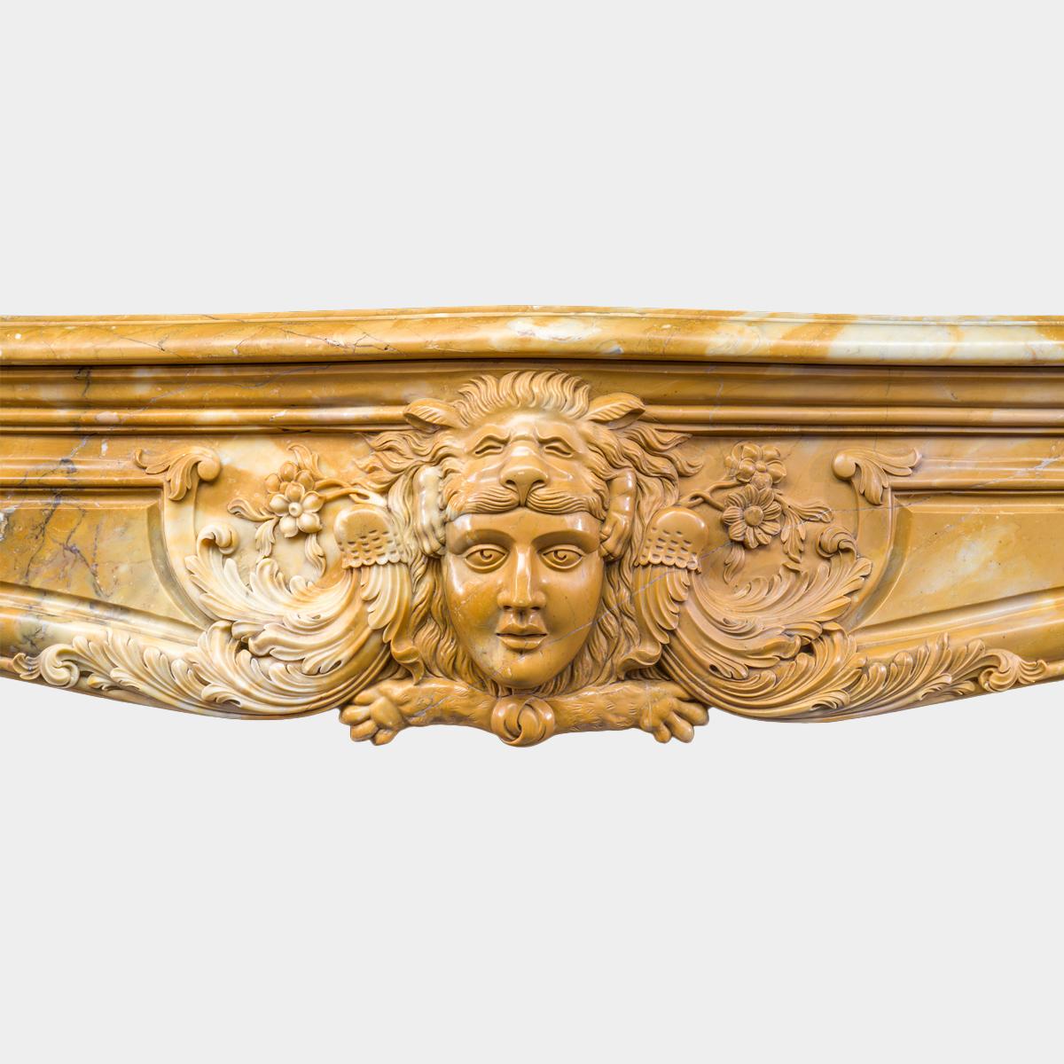 Hand-Carved A Large Rococo Carved Siena Marble Fireplace Mantel For Sale