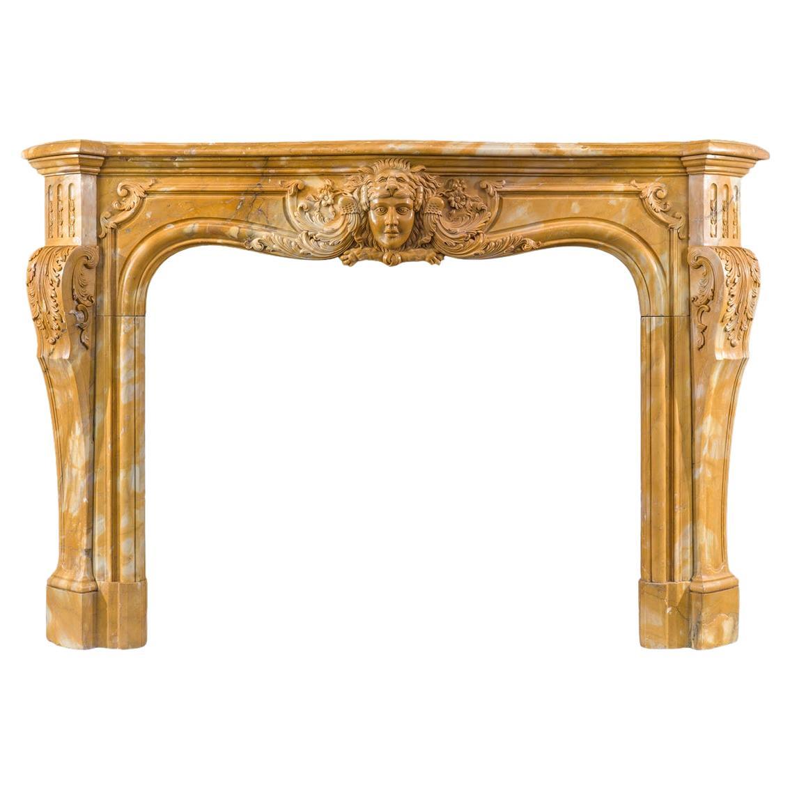 A Large Rococo Carved Siena Marble Fireplace Mantel For Sale