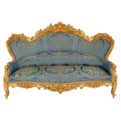 Large Rococo Revival Carved Giltwood Sofa
