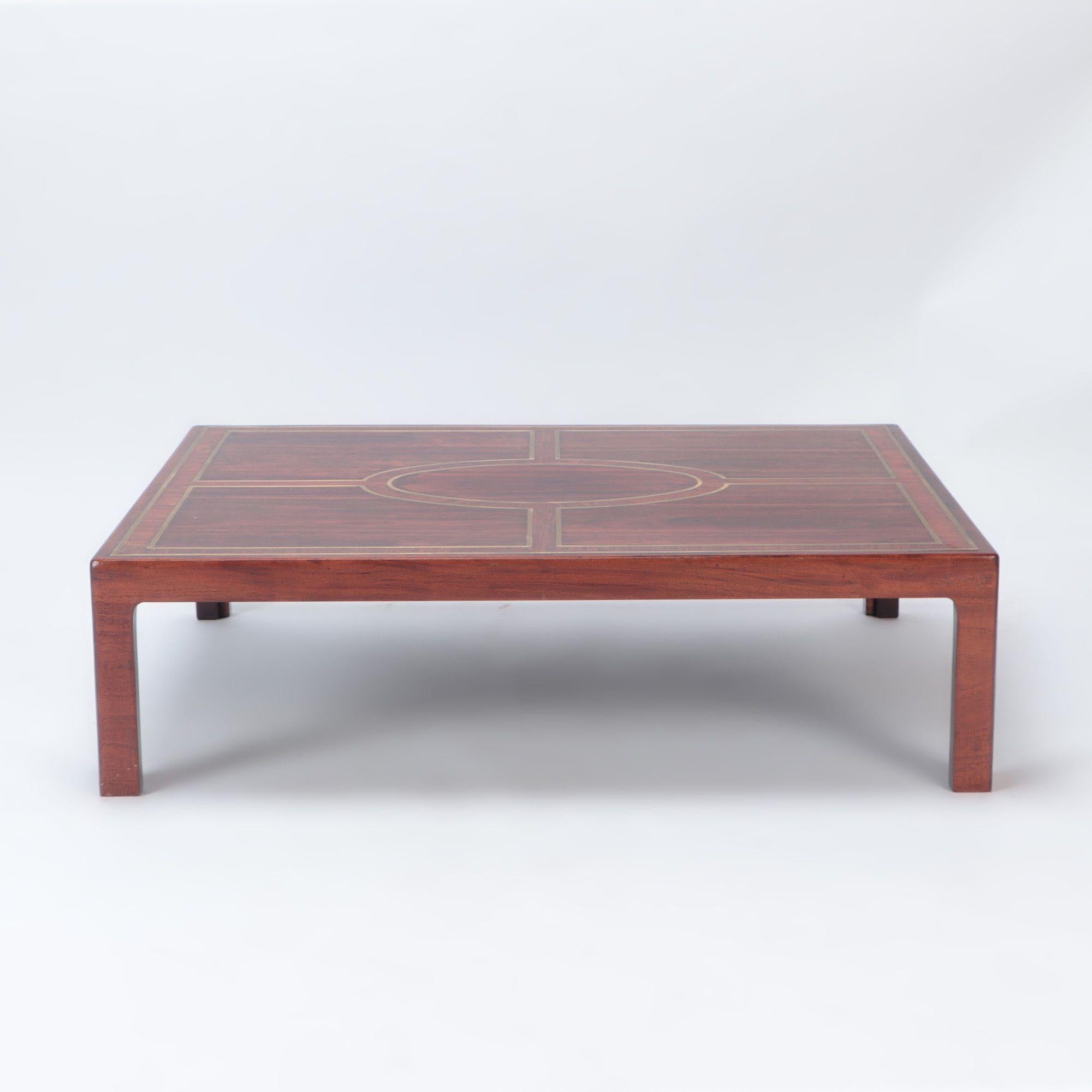 A large rosewood and brass inlaid Brazilian coffee table. C 1975.