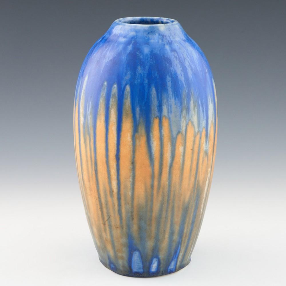 A Large Ruskin Pottery Vase, 1930

Additional Information:
Heading :Ruskin pottery vase 
Date : 1930
Origin : Smethwick, Staffordshire
Bowl Features : Matt crystalline glaze with pale orange and blue colouring. 
Marks : Ruskin England 1930 impressed