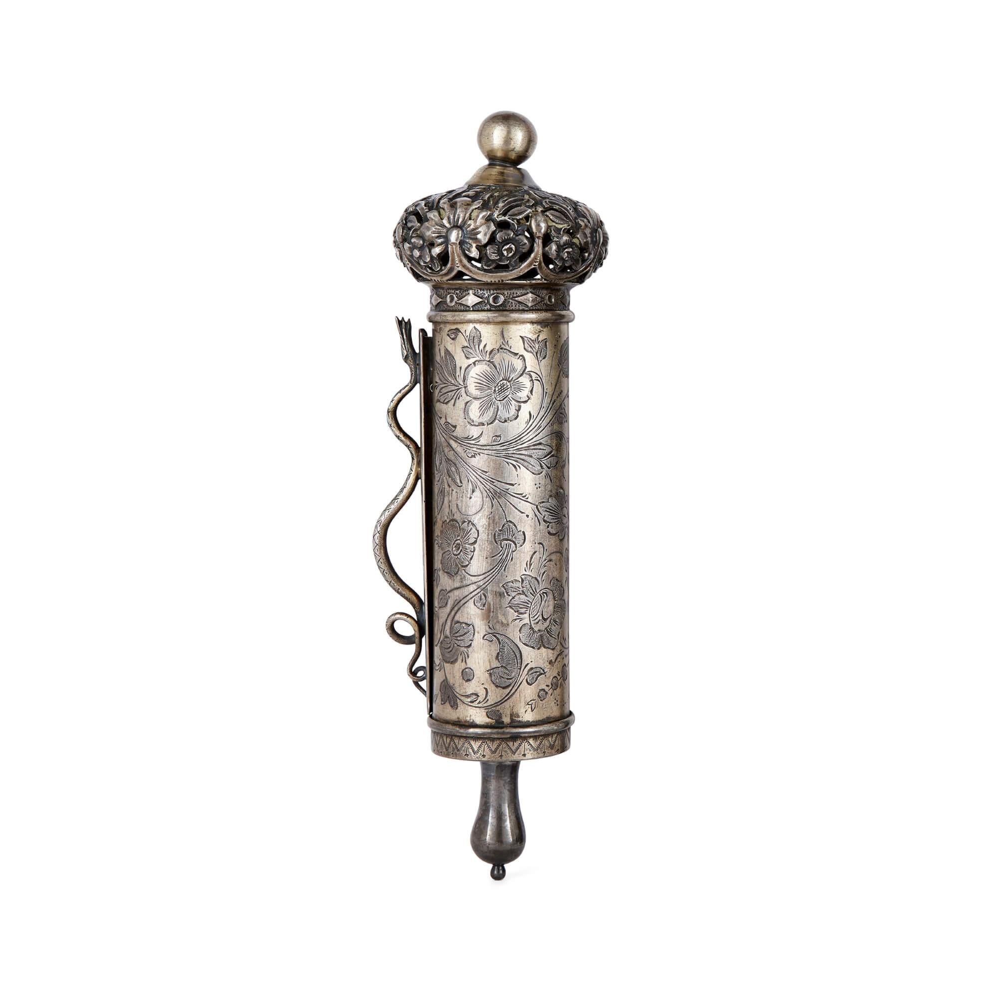 A large Russian silver Jewish Megillah case and scroll
Russian, 19th century
Measures: height 23cm, diameter 7cm

This remarkable piece is a Russian Judaica Megillah scroll and case, relatively large for its size, made with beautifully crafted
