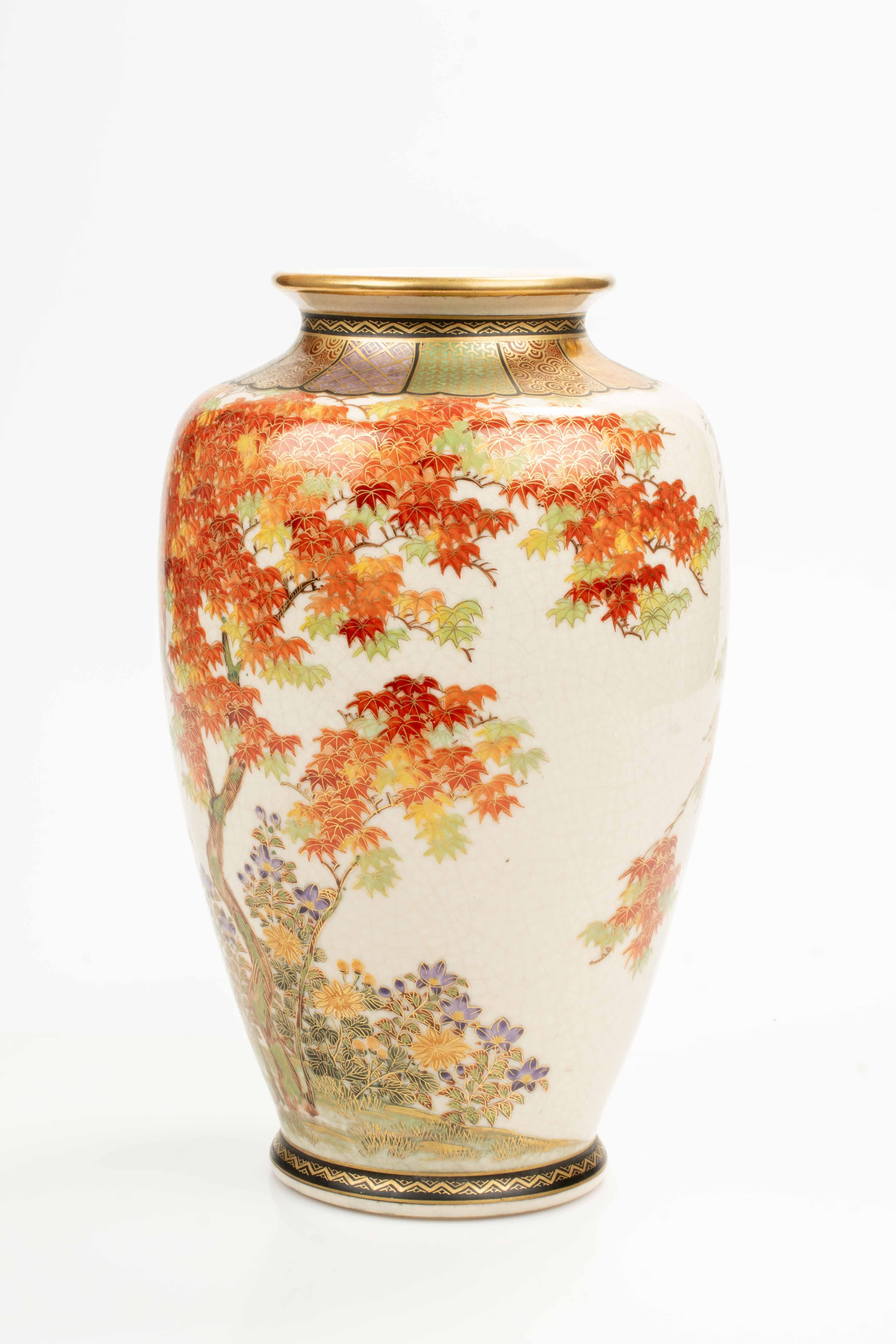 A large Satsuma vase, finely decorated with polychrome enamels and gilt details, depicting a majestic Japanese maple tree (momiji).

The vase bears a double signature: on the side is inscribed Shygetsu saku, while beneath the base appears Nikko-zo
