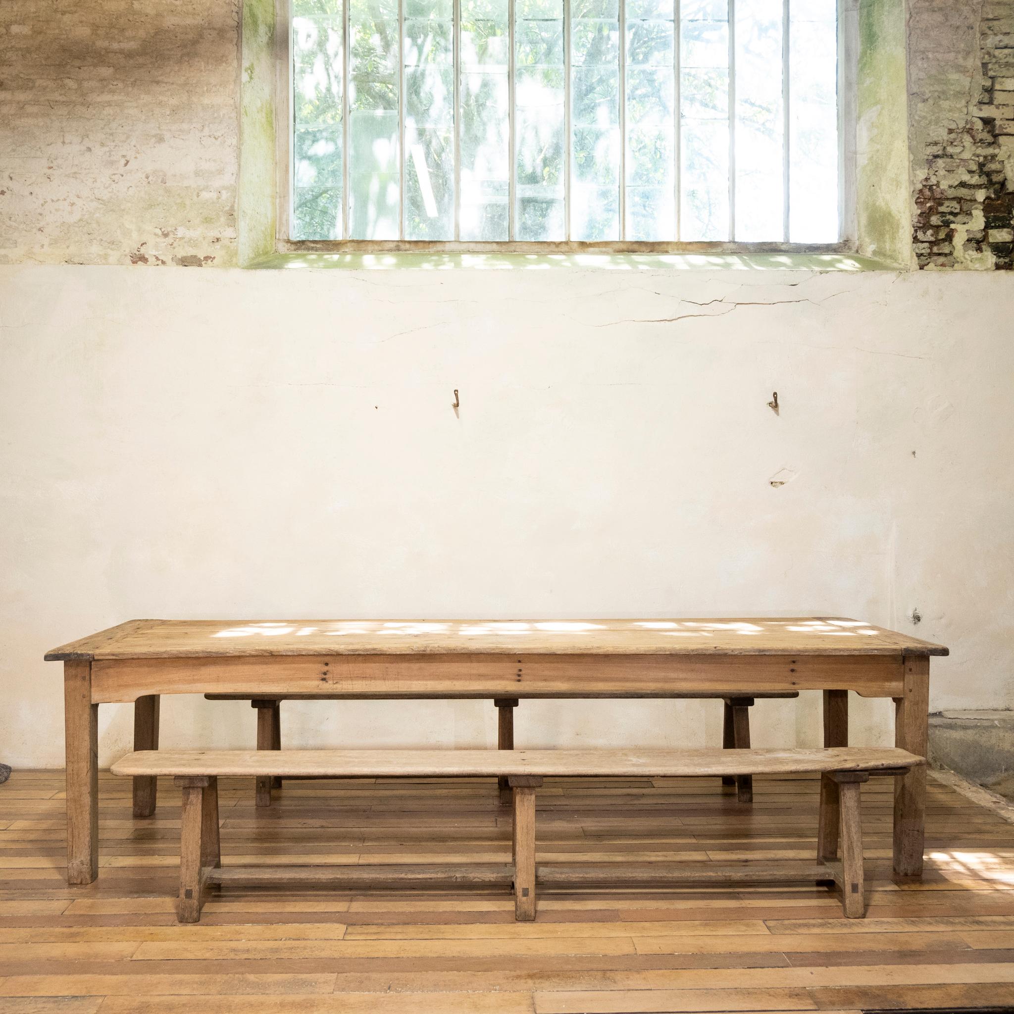 An exceptional large scale 19th-century French sycamore and oak two plank farmhouse table. Raised on slightly tapered legs, demonstrating a large deep drawer located to one end of the table with a simplistic hand-forged handle. Displaying a striking