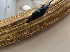 A large scale 19th Century Giltwood Oval Mirror