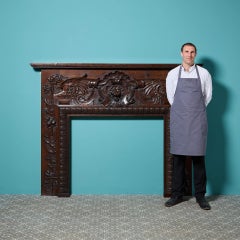 A large scale 19th century Victorian carved English oak fireplace. Dating to cir