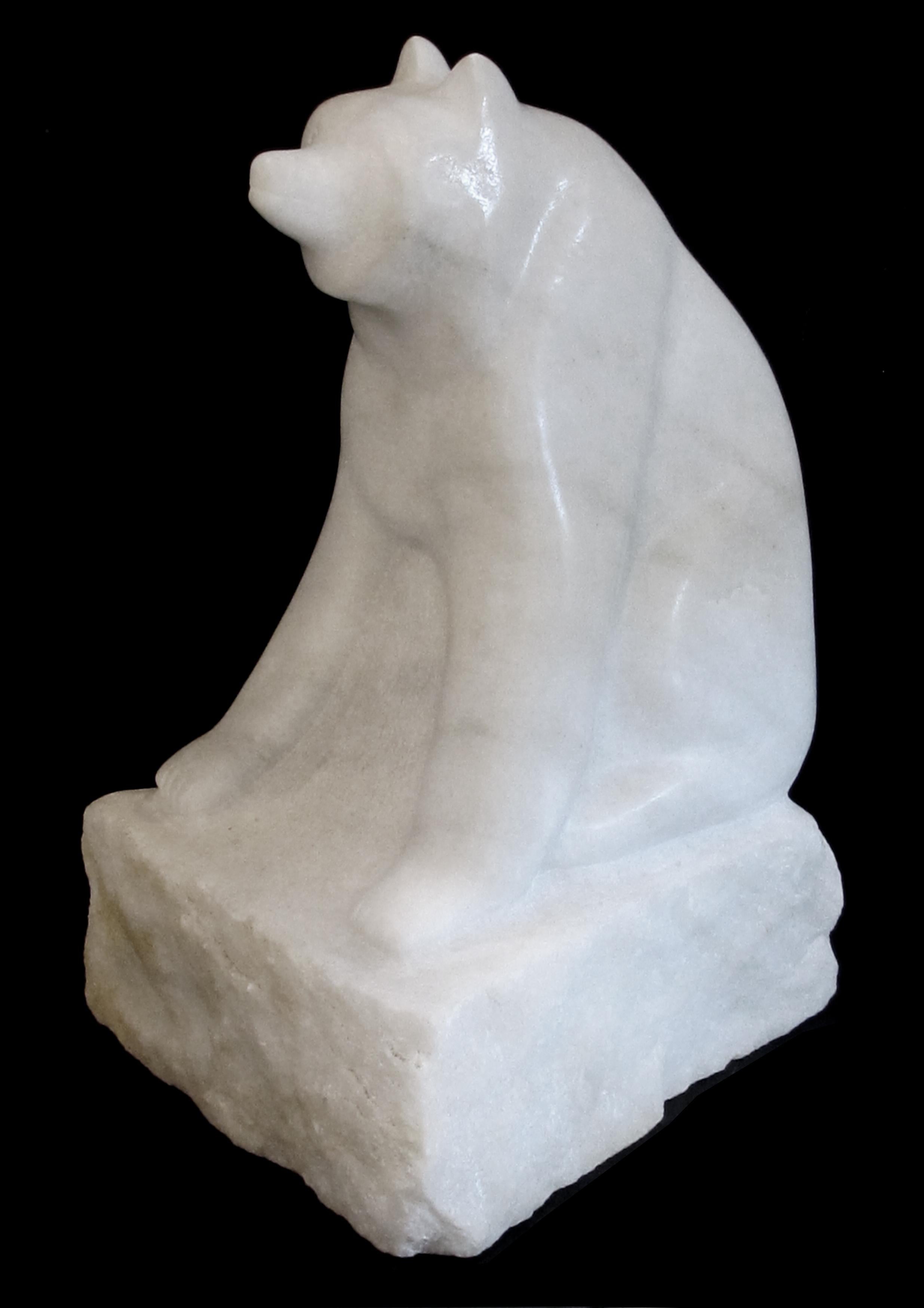 A large-scaled and expressive carved marble figure of a seated red panda bear with its distinctive puffy tail; the firmly seated bear with direct gaze resting on a square base; the red panda is considered to be a 'good luck charm' and brings good