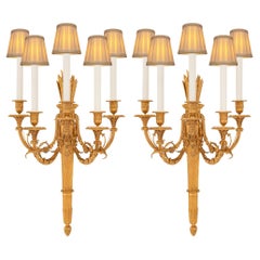 A large scaled pair of French 19th century Louis XVI st. Ormolu sconces