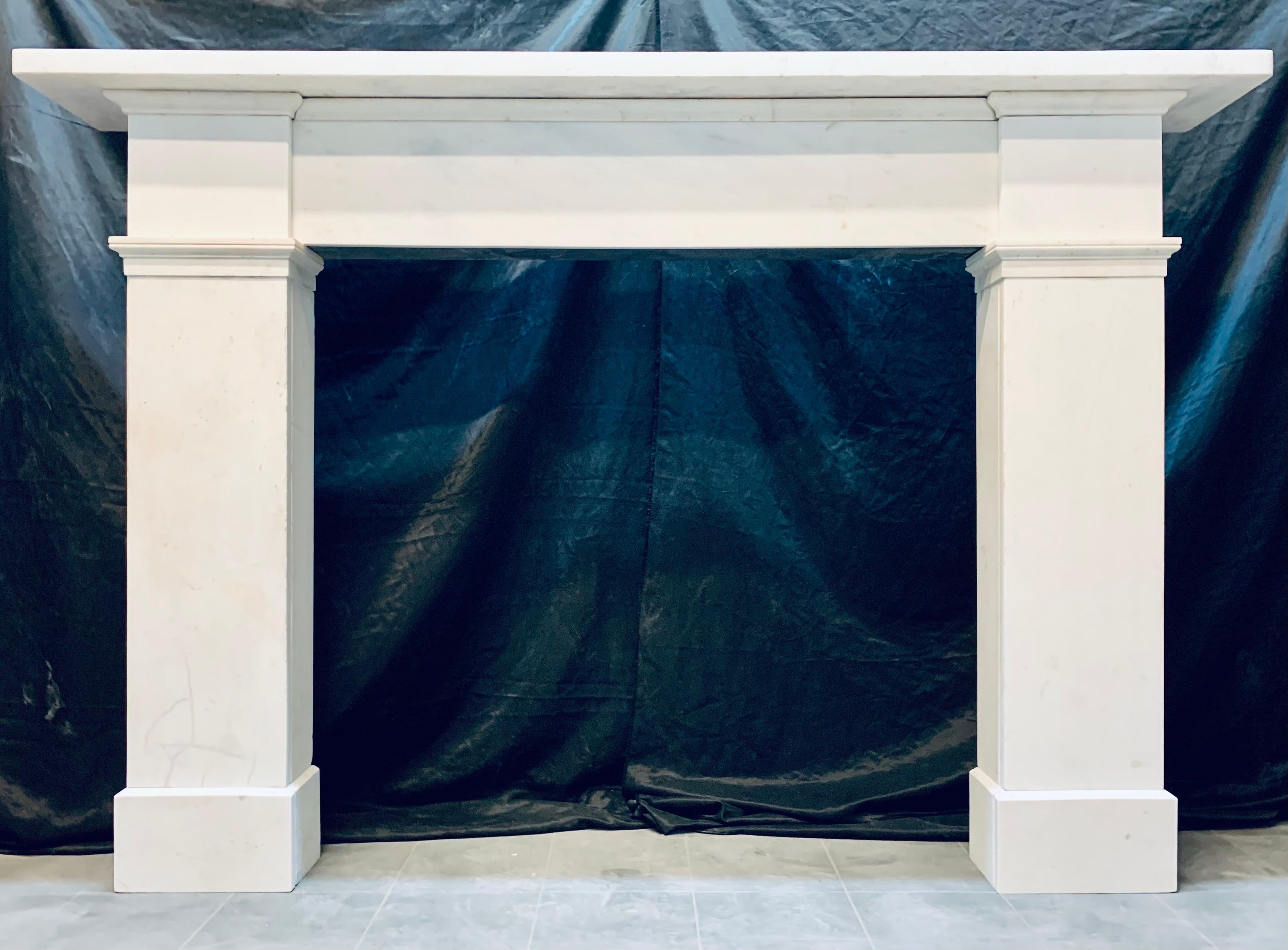A very large Scottish Georgian early 19th
century statuary marble fireplace surround
originally from Edinburgh's New Town.

A generous square edged top shelf, sits
above an unadorned central frieze with a full wrap around top cornice, 
flanked by