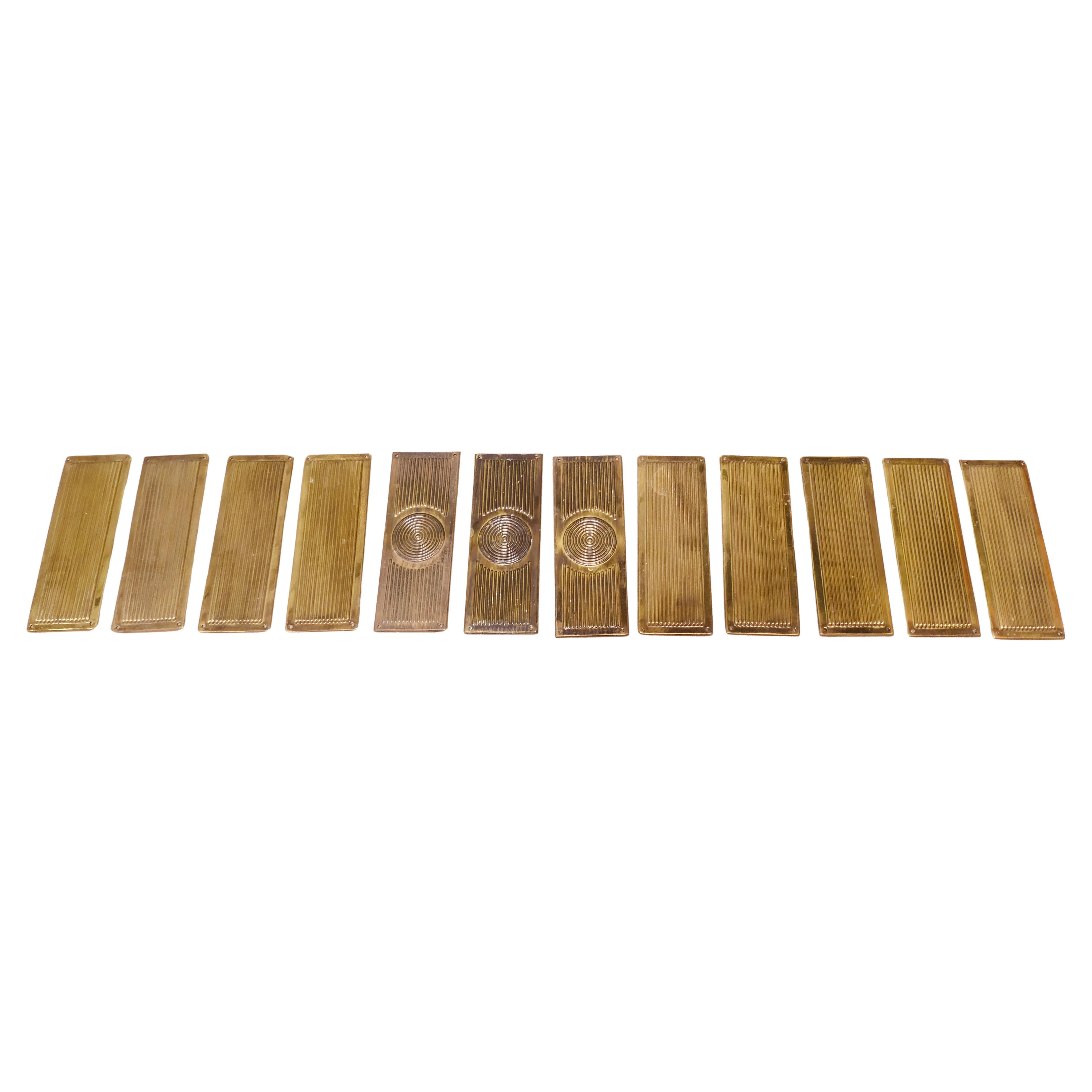 A Large Set of 12 Art Deco Brass Door Finger Plates For Sale