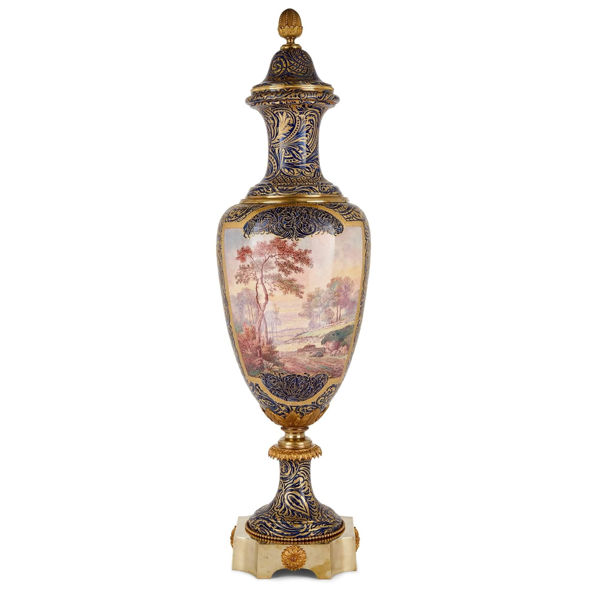 A large Sèvres style, mounted and gilt, painted porcelain vase
French, Early 20th Century
Height 132cm, diameter 37cm

This exquisite piece is a beautiful Sèvres style porcelain vase, with painted cartouches on each face, mounted, and adorned