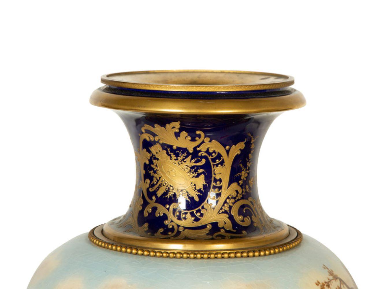 A large Sèvres style porcelain urn raised on a bronze plinth. France, circa 1880.
Measures: Height 25
