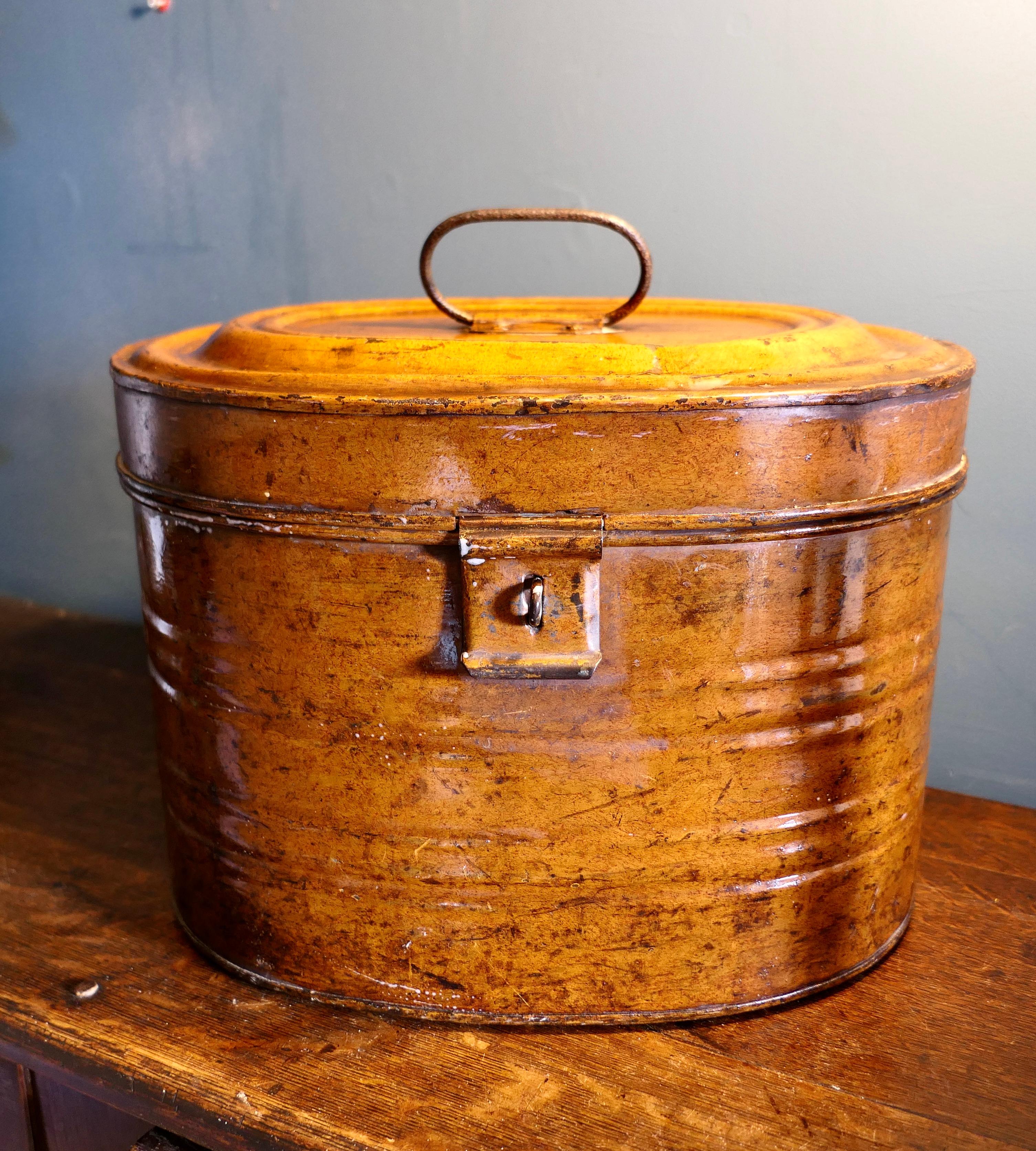 A large size Victorian original painted tin hat box

The hat Box is in its original paint with a lockable clasp, it is a pretty and useful piece and it is in good sound antique condition both inside and out 
The Hat Box is oval in shape it is 12”
