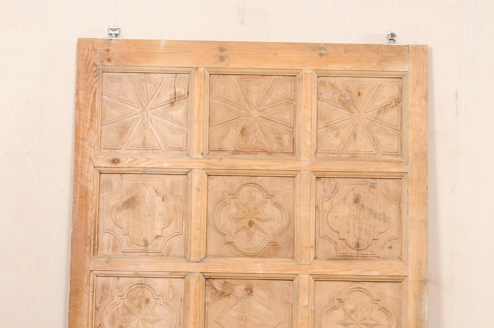 A Large-Sized Spanish Wooden Door w/Decoratively Carved Panels In Good Condition For Sale In Atlanta, GA