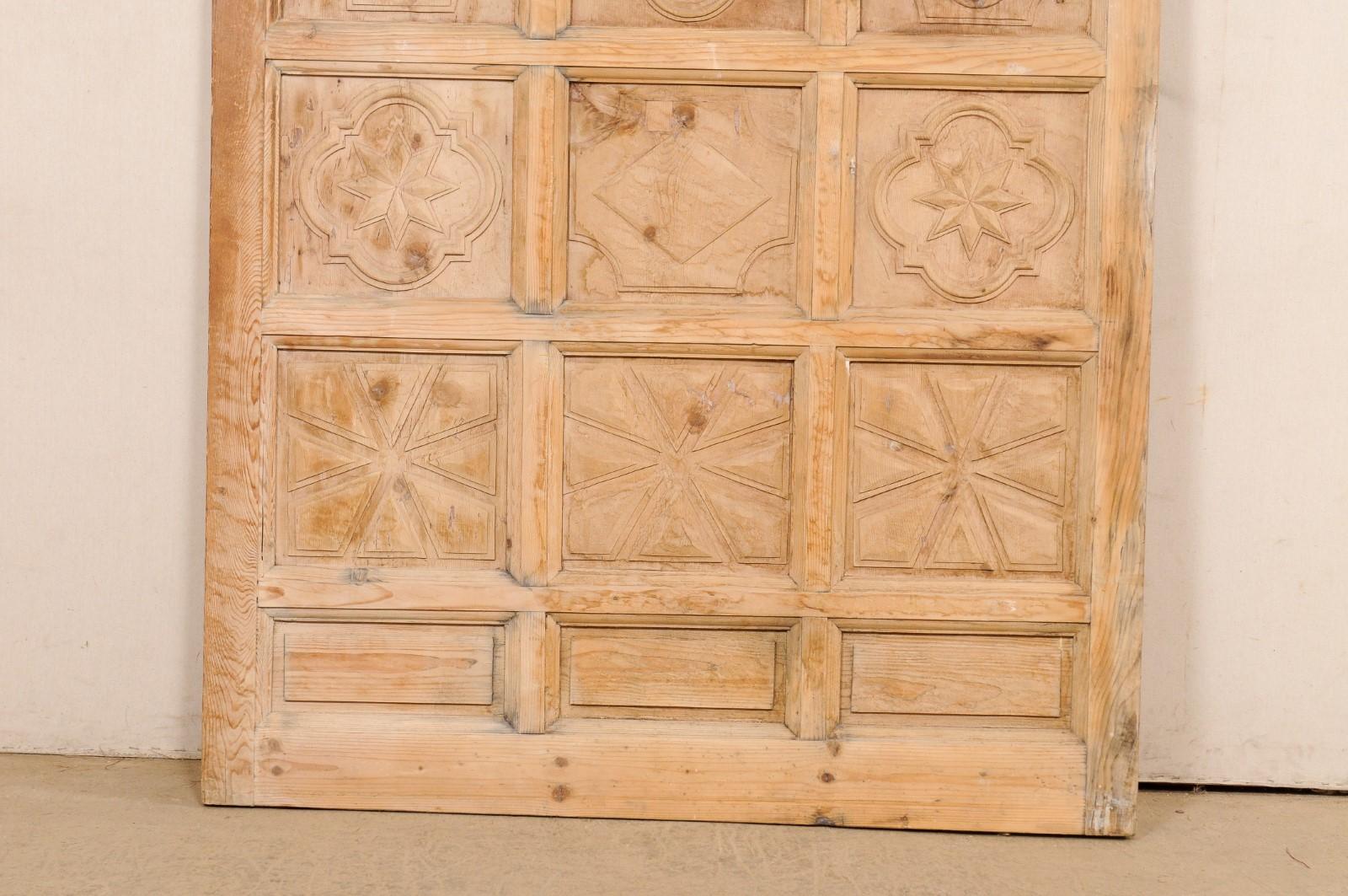 20th Century A Large-Sized Spanish Wooden Door w/Decoratively Carved Panels For Sale